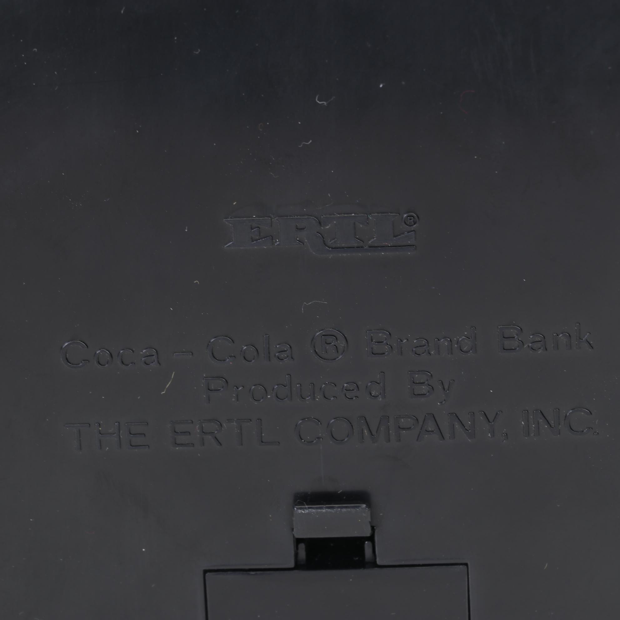 Coca-Cola Christmas Decorations with Three Banks, a Figurine, and a Bobblehead