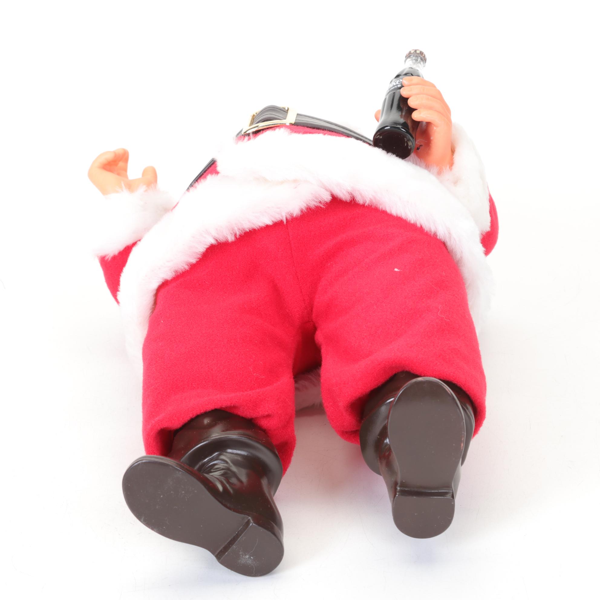 Coca-Cola Christmas Decorations with Three Banks, a Figurine, and a Bobblehead