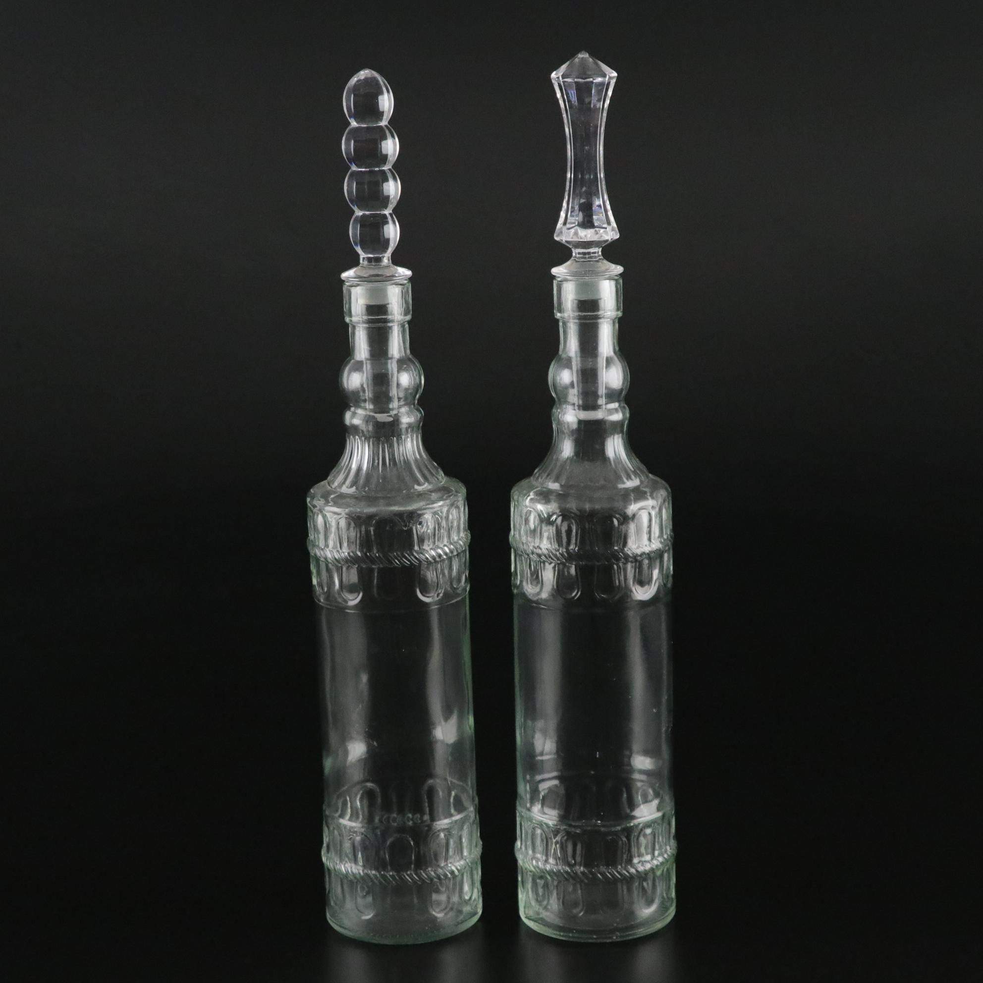 Pair of Molded Glass Bottles with Decorative Crystal Stoppers
