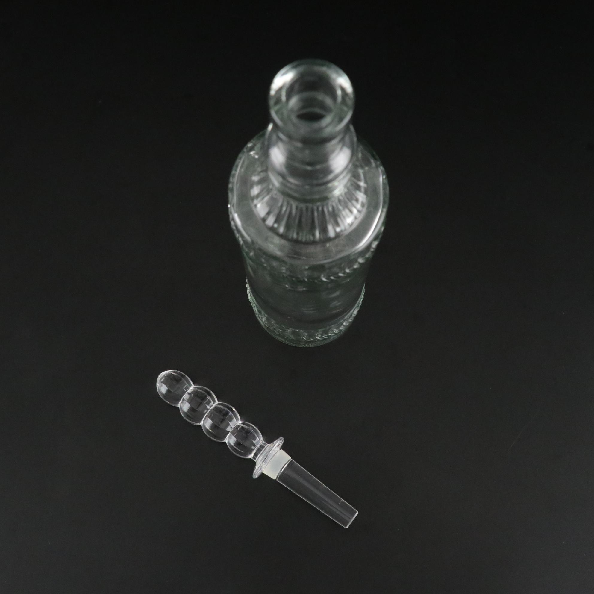 Pair of Molded Glass Bottles with Decorative Crystal Stoppers