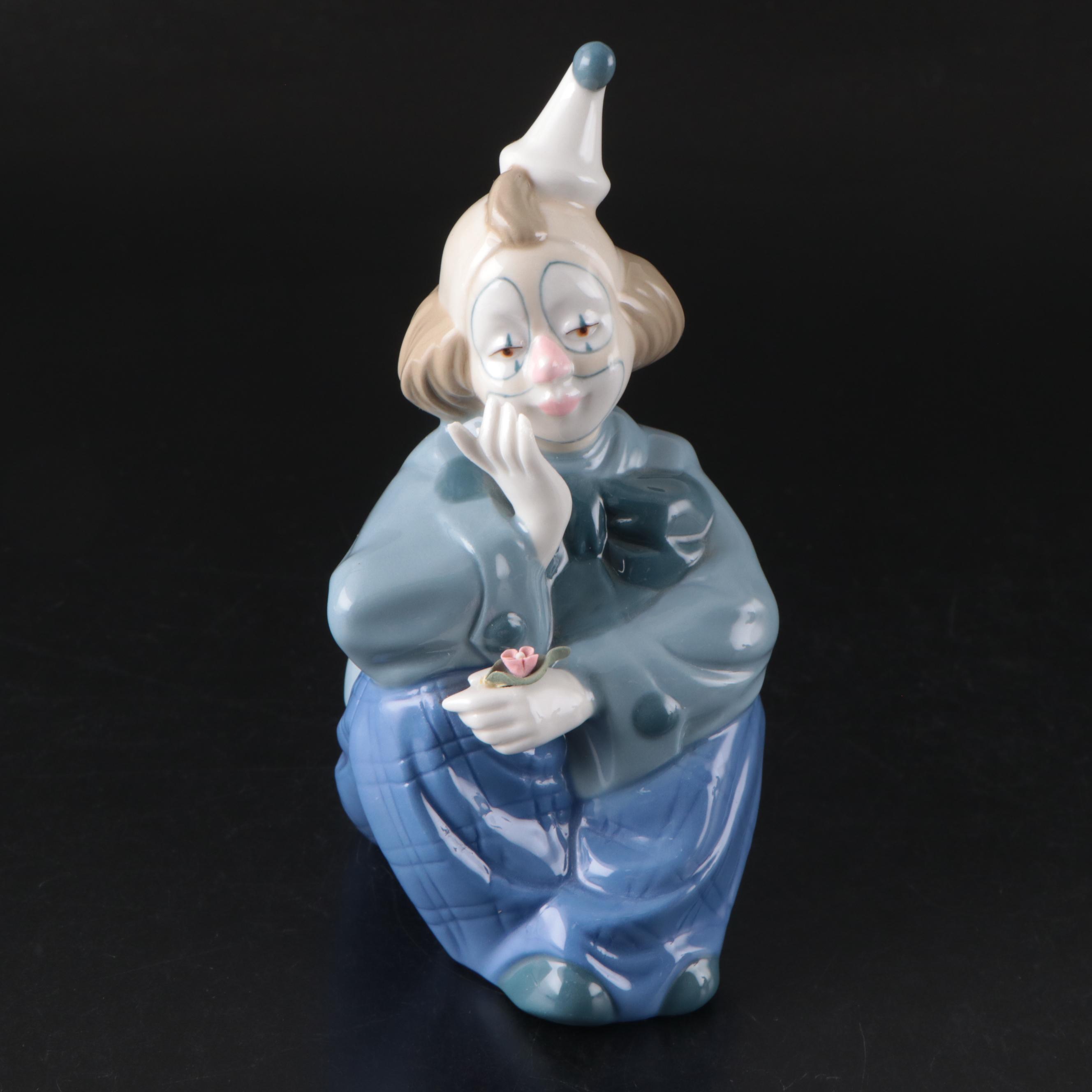 Porcelana de Cuernavaca Sitting Clown Figurine with Other Porcelain Figurines