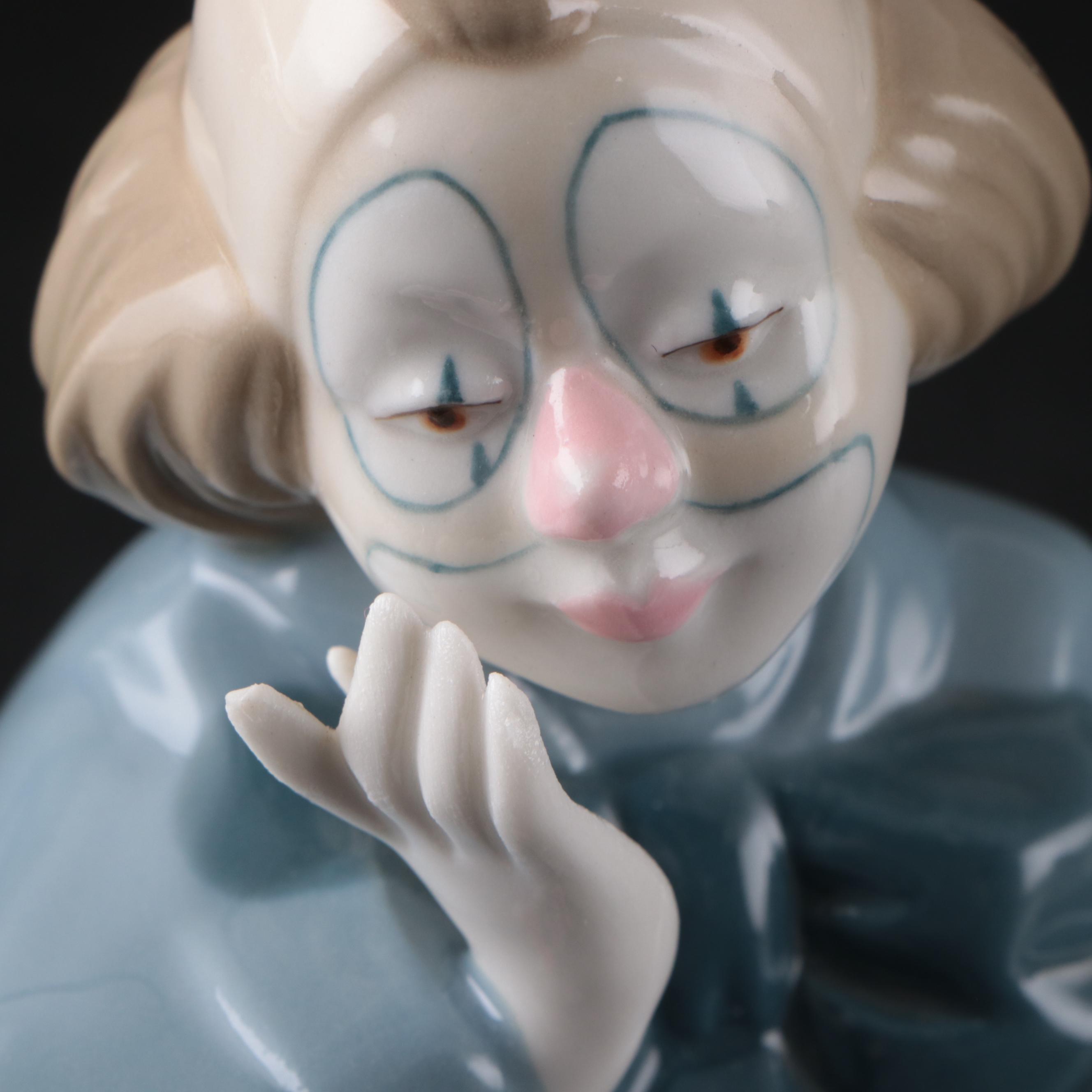 Porcelana de Cuernavaca Sitting Clown Figurine with Other Porcelain Figurines