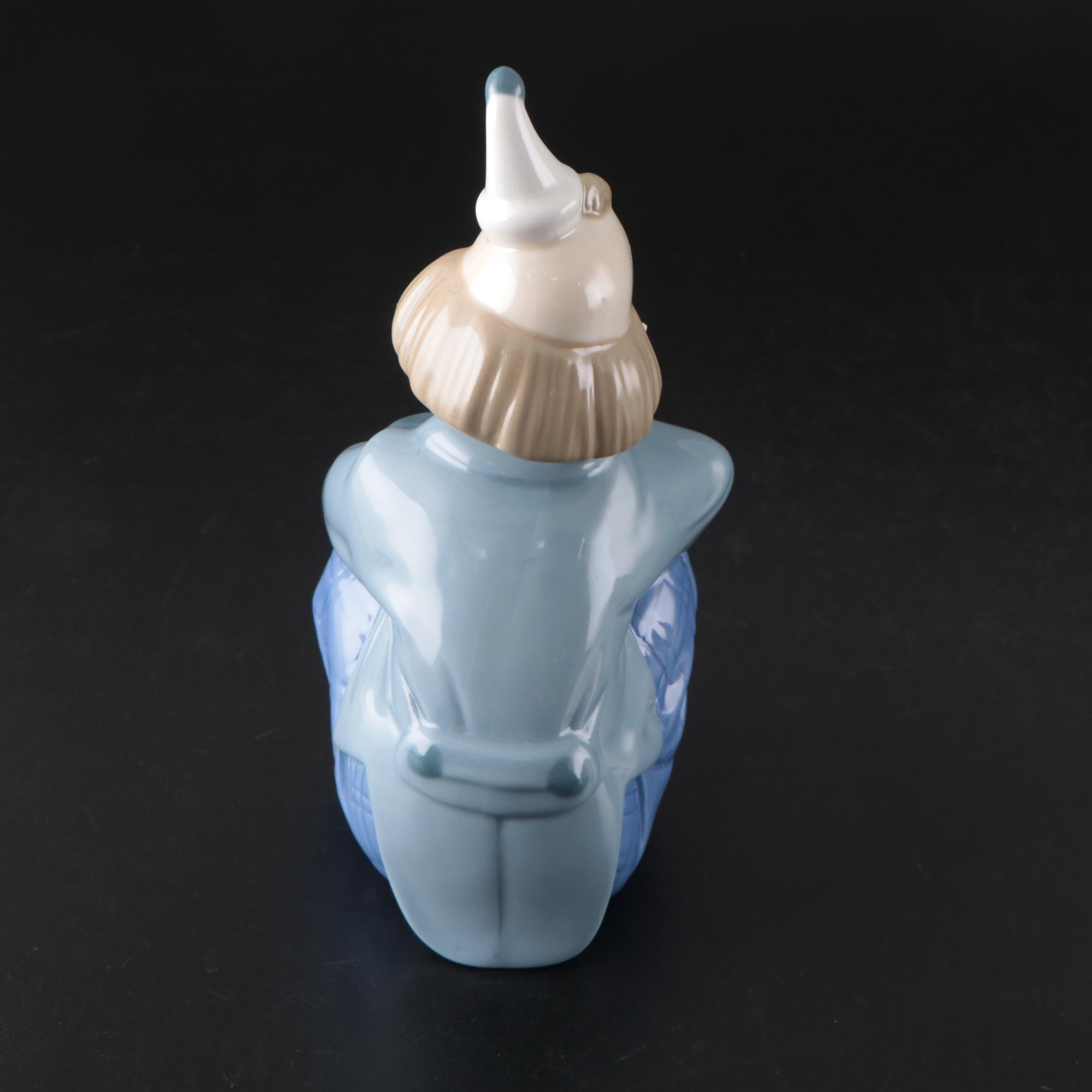 Porcelana de Cuernavaca Sitting Clown Figurine with Other Porcelain Figurines