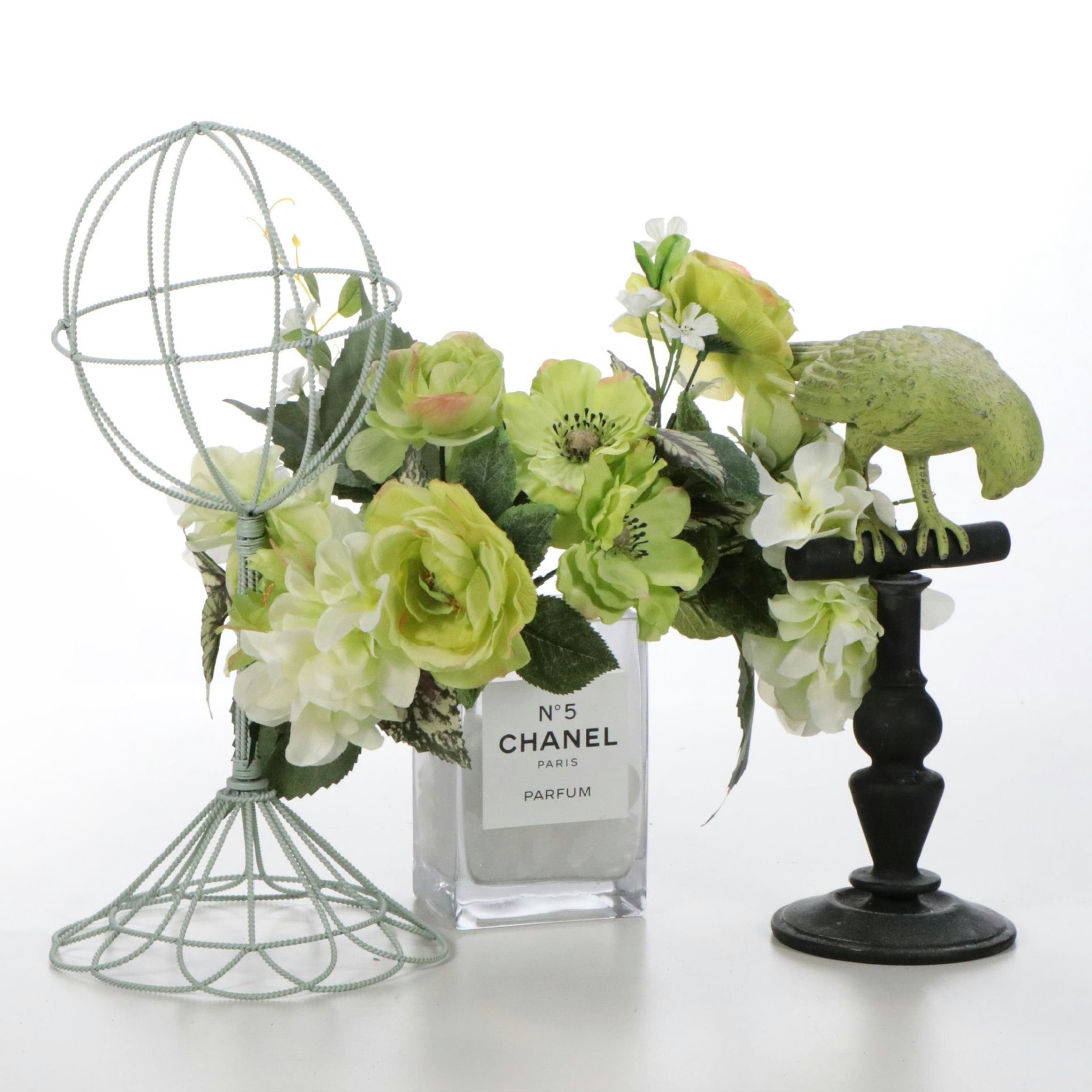 Faux Floral Arrangement in Chanel No. 5 Perfume Bottle Vase with Parrot Figurine