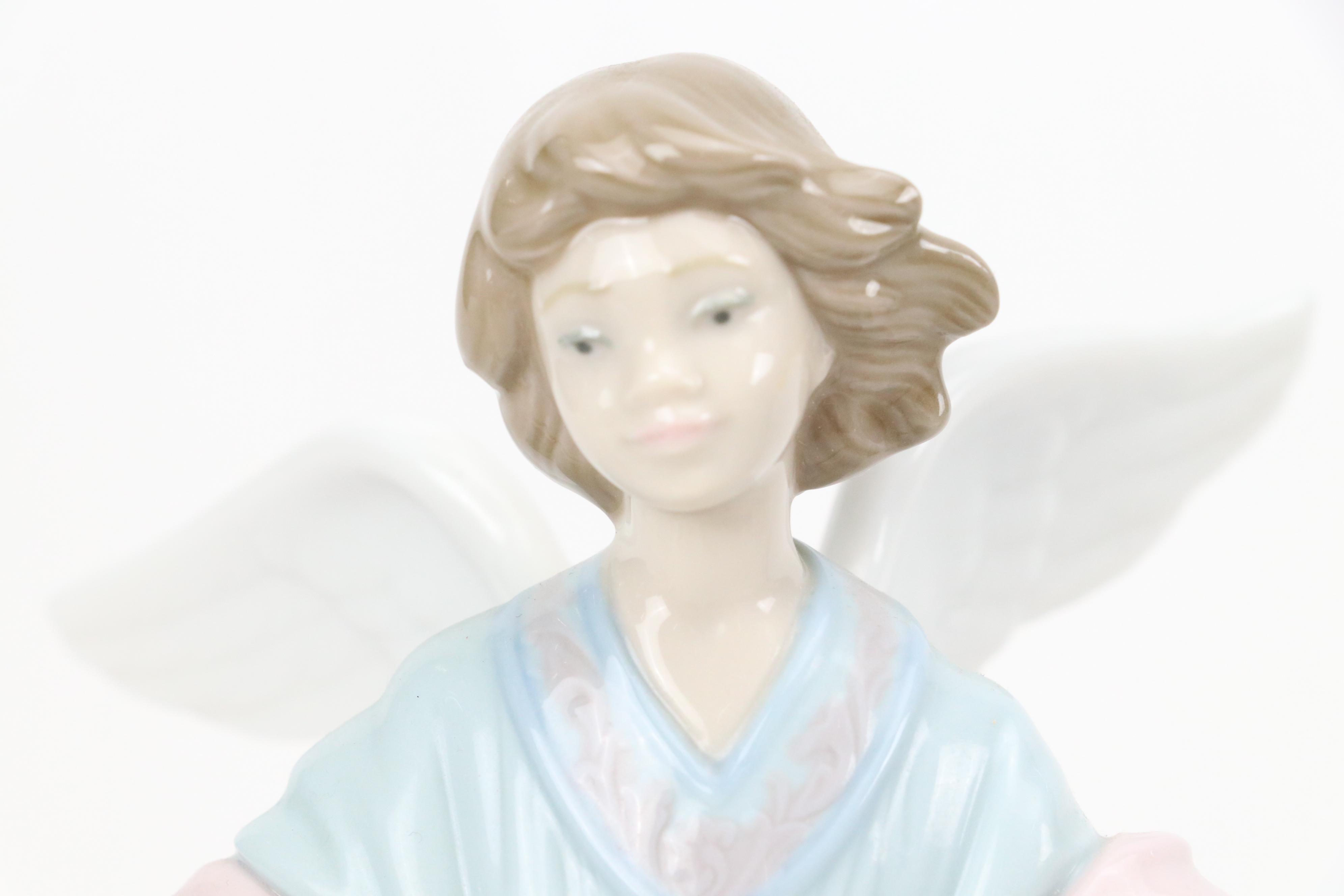 Lladró "Angel of the Stars," "Joyful Offering" and "Rejoice" Porcelain Figurines