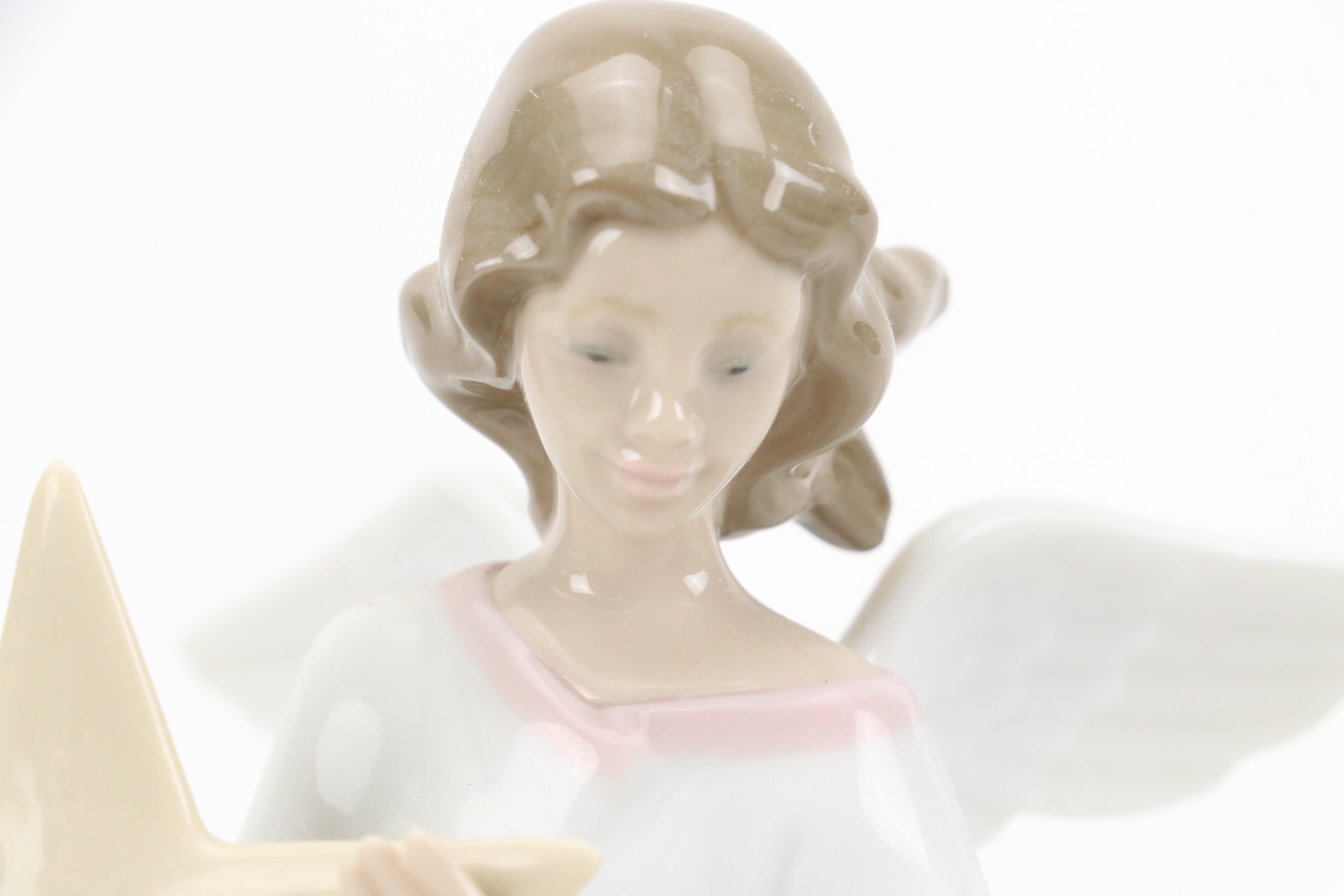 Lladró "Angel of the Stars," "Joyful Offering" and "Rejoice" Porcelain Figurines