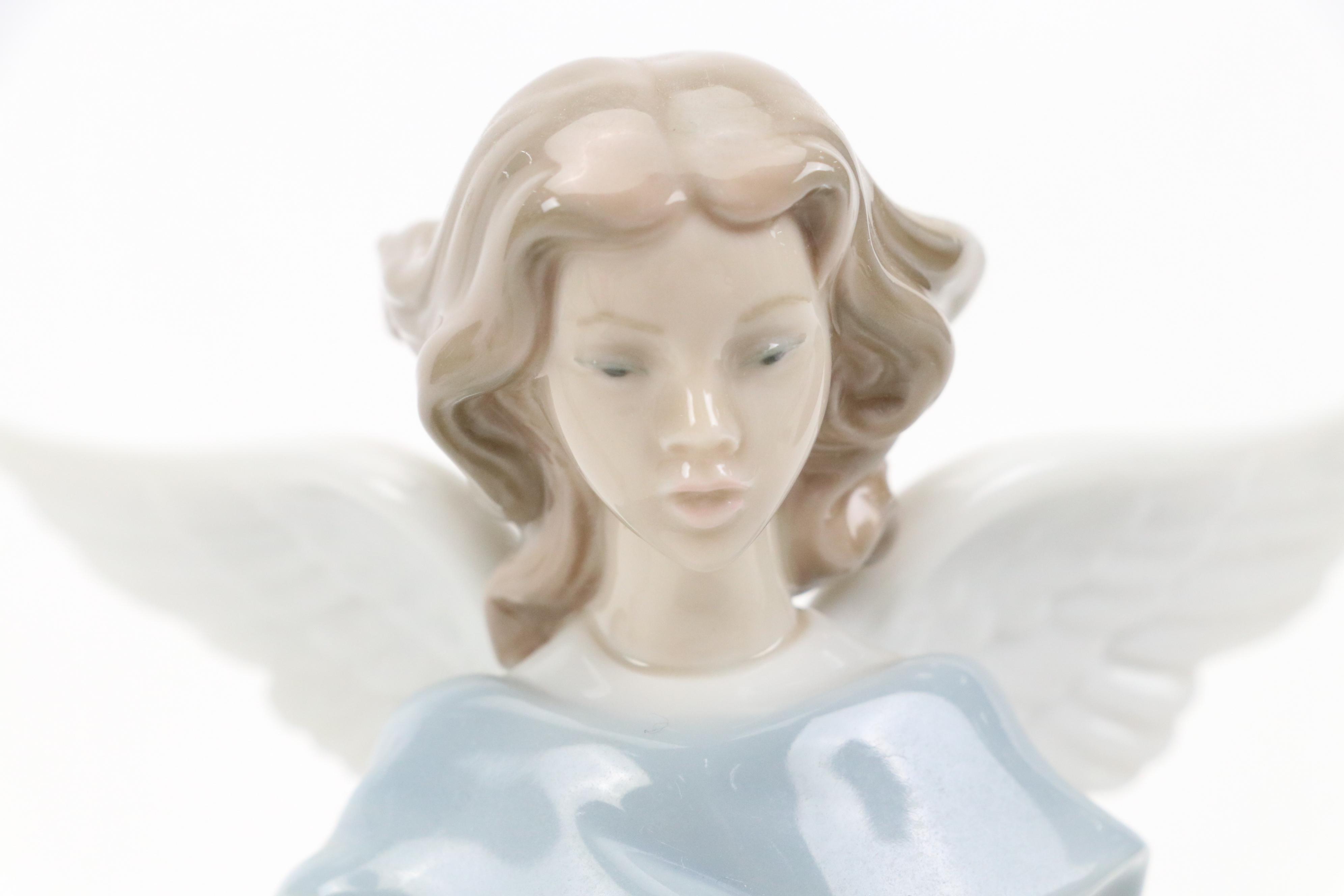 Lladró "Angel of the Stars," "Joyful Offering" and "Rejoice" Porcelain Figurines