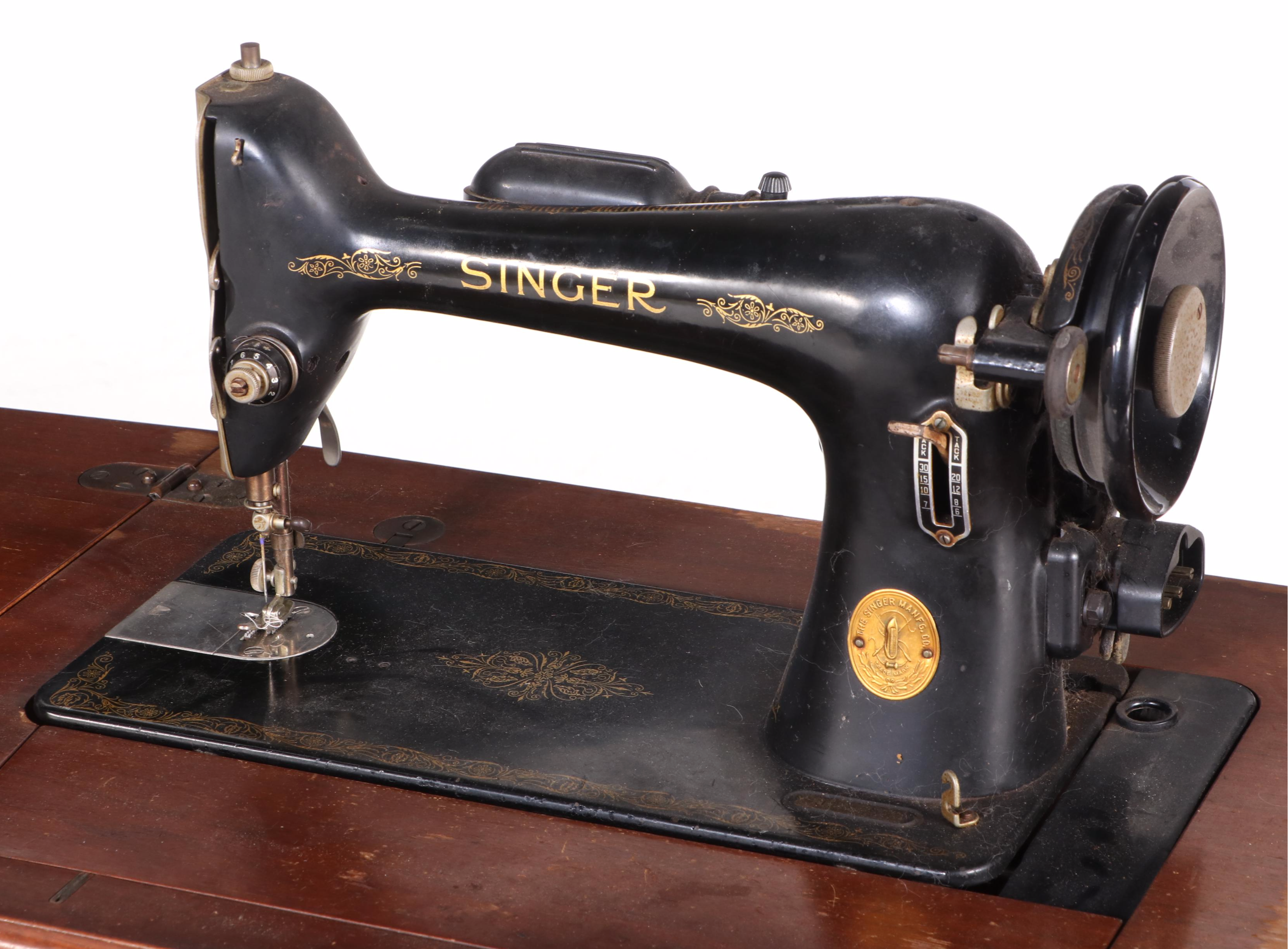 The Singer Manufacturing Co. Sewing Machine in Walnut Cabinet, Mid-20th Century