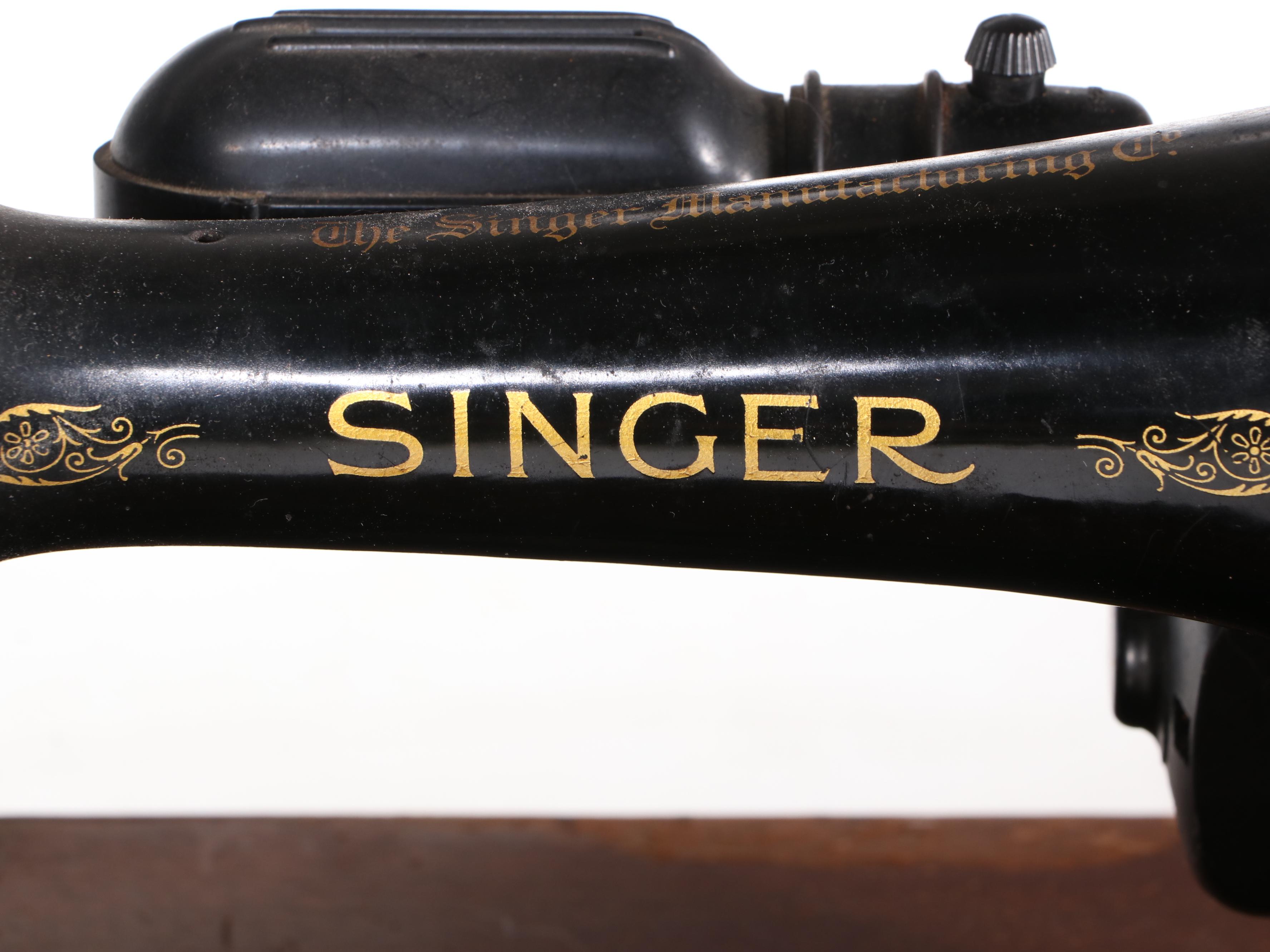 The Singer Manufacturing Co. Sewing Machine in Walnut Cabinet, Mid-20th Century