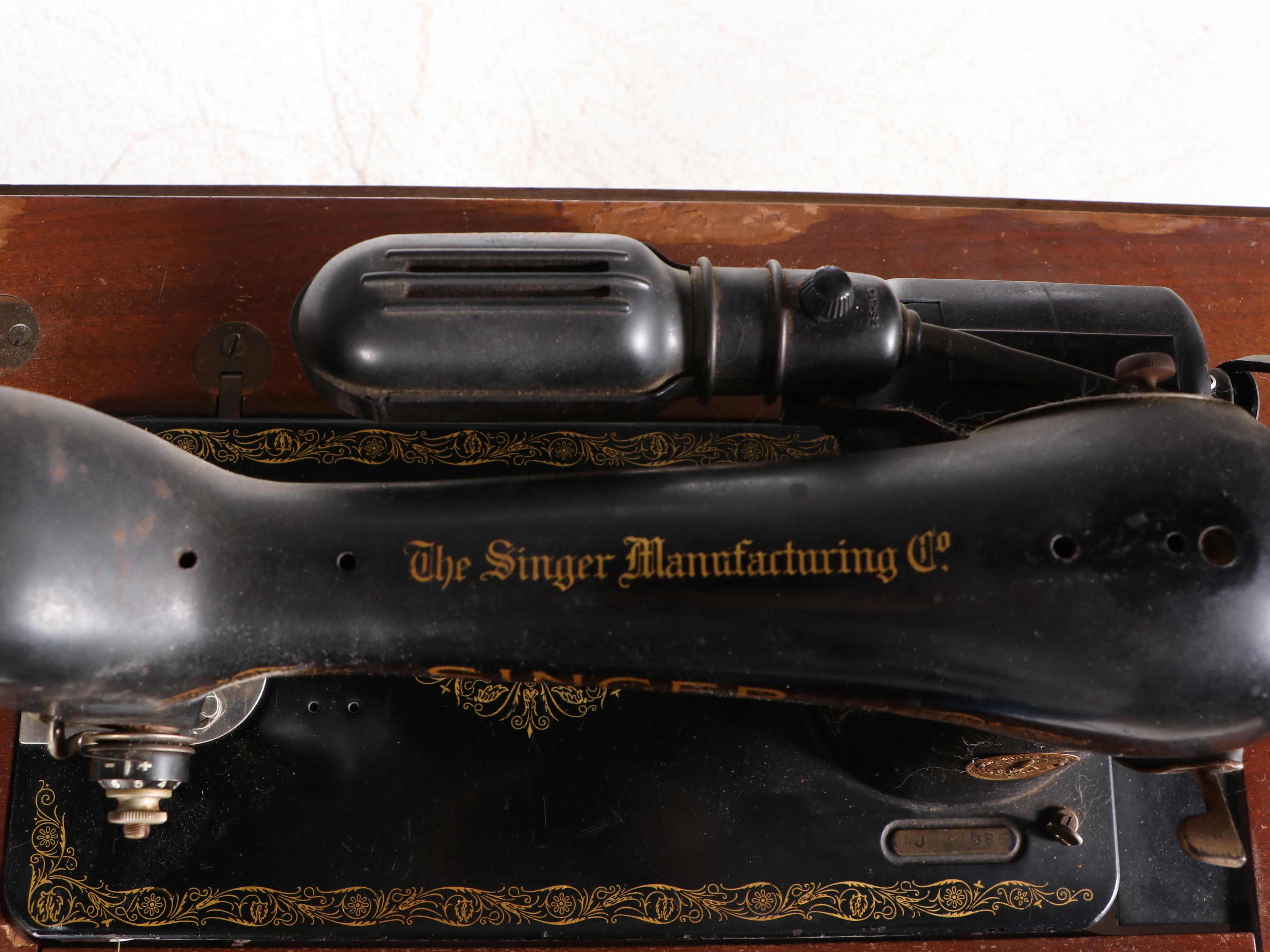 The Singer Manufacturing Co. Sewing Machine in Walnut Cabinet, Mid-20th Century