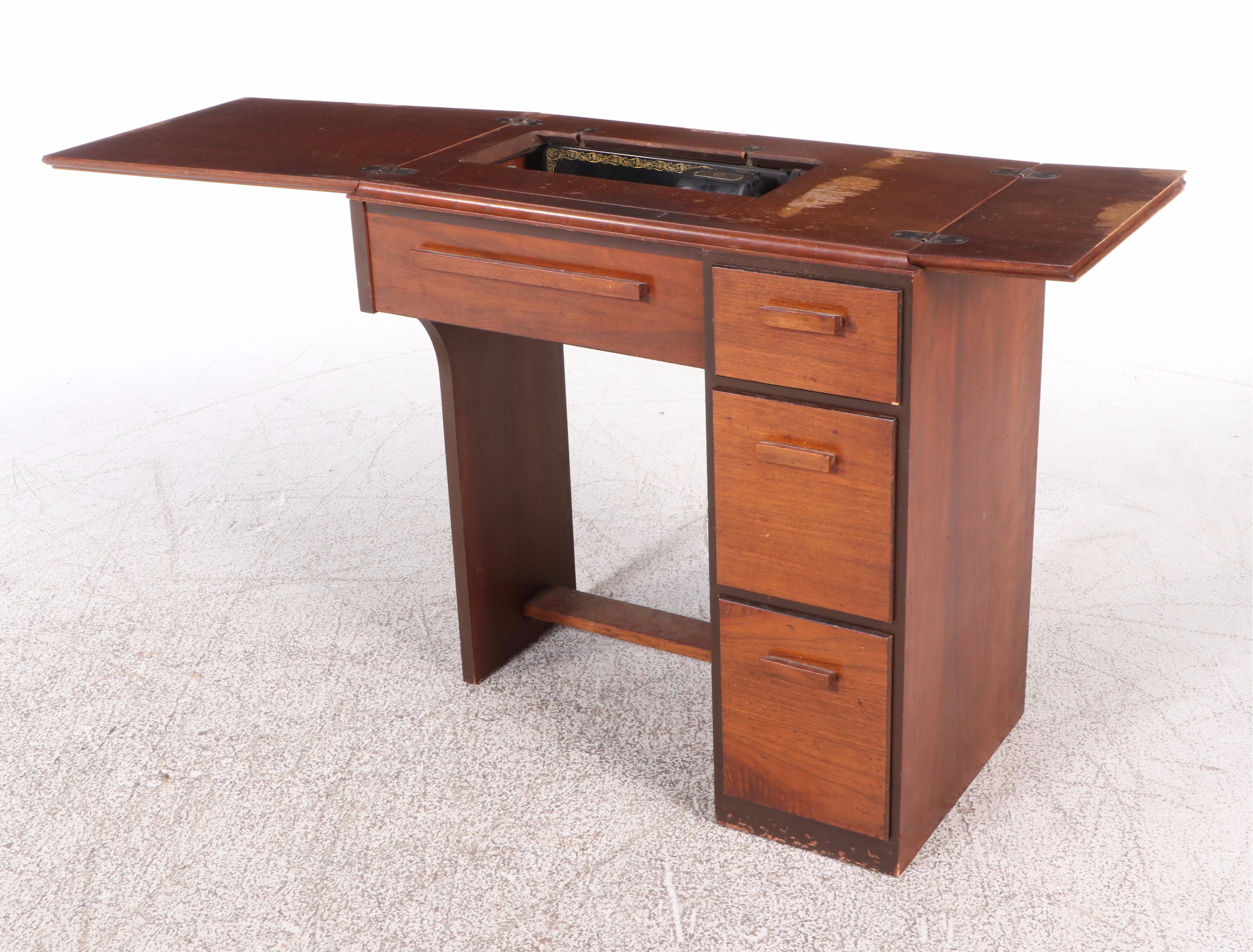 The Singer Manufacturing Co. Sewing Machine in Walnut Cabinet, Mid-20th Century