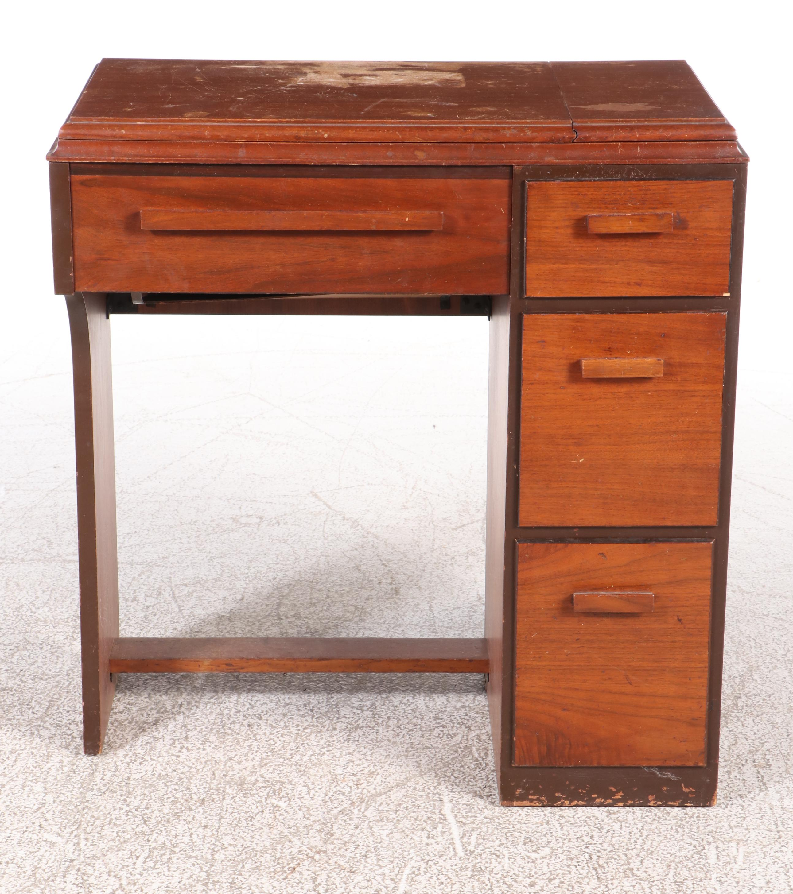 The Singer Manufacturing Co. Sewing Machine in Walnut Cabinet, Mid-20th Century