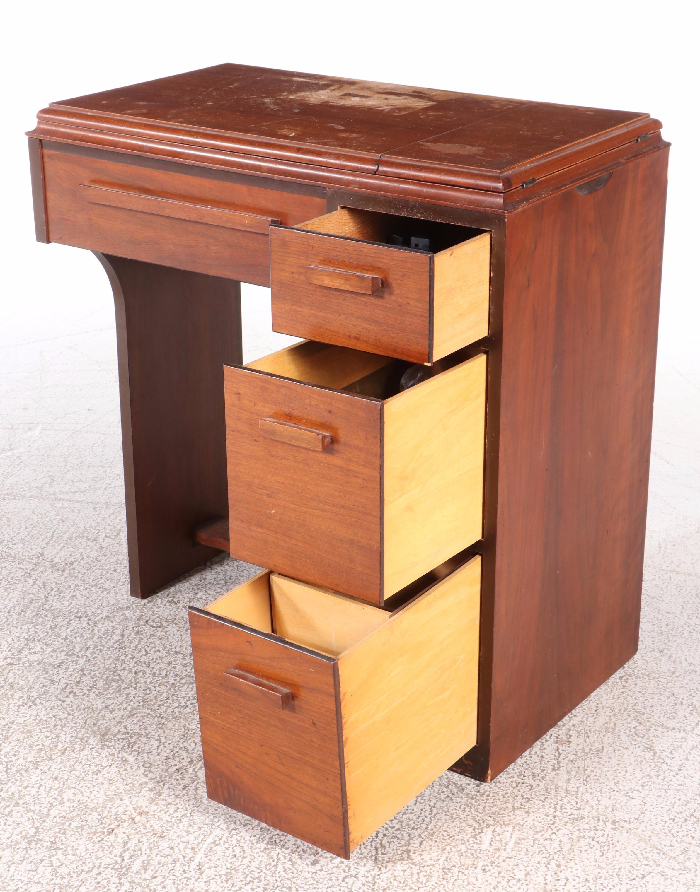 The Singer Manufacturing Co. Sewing Machine in Walnut Cabinet, Mid-20th Century