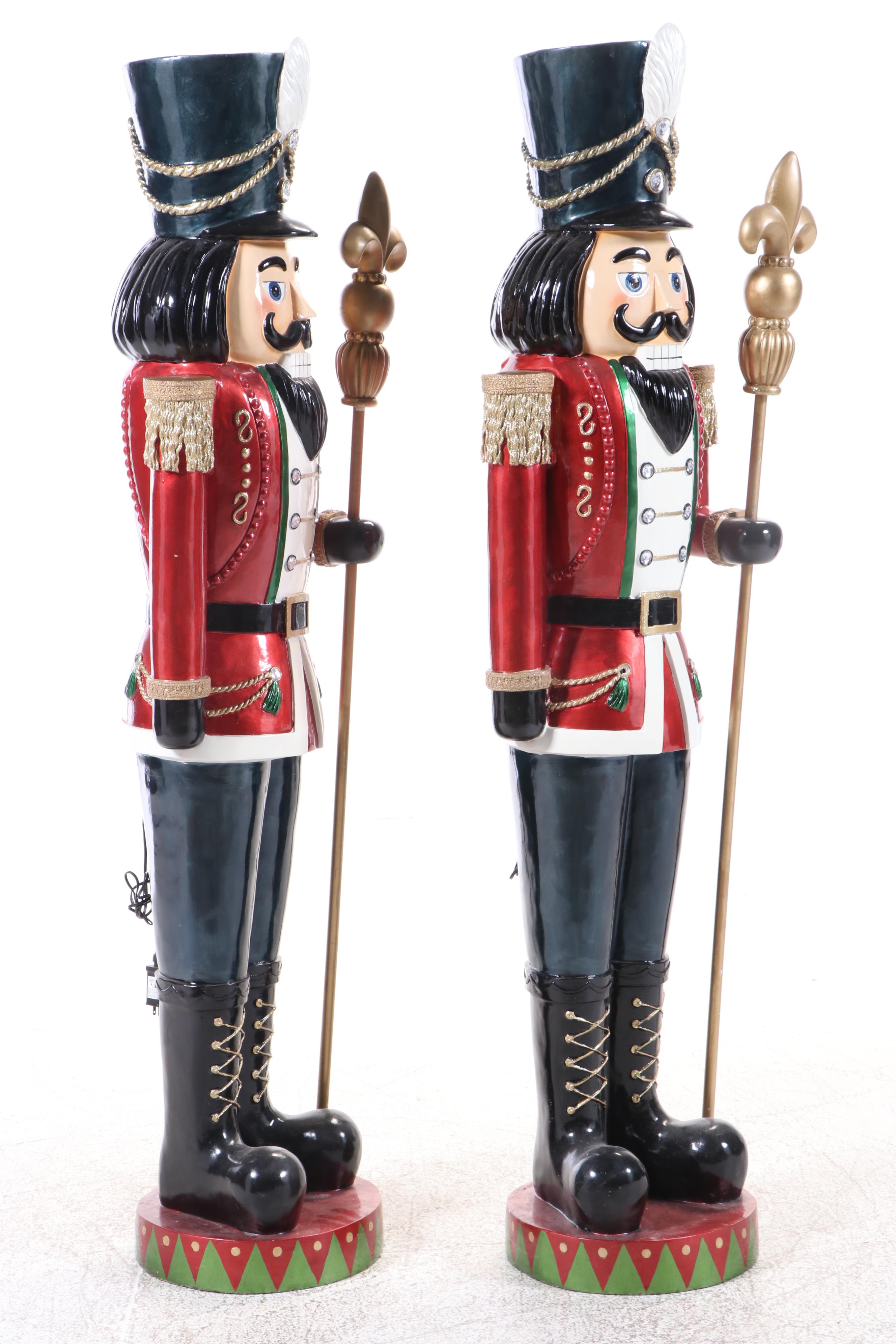 Pair of Molded and Painted Fiberglass Illuminated Life-Size Nutcracker Statues