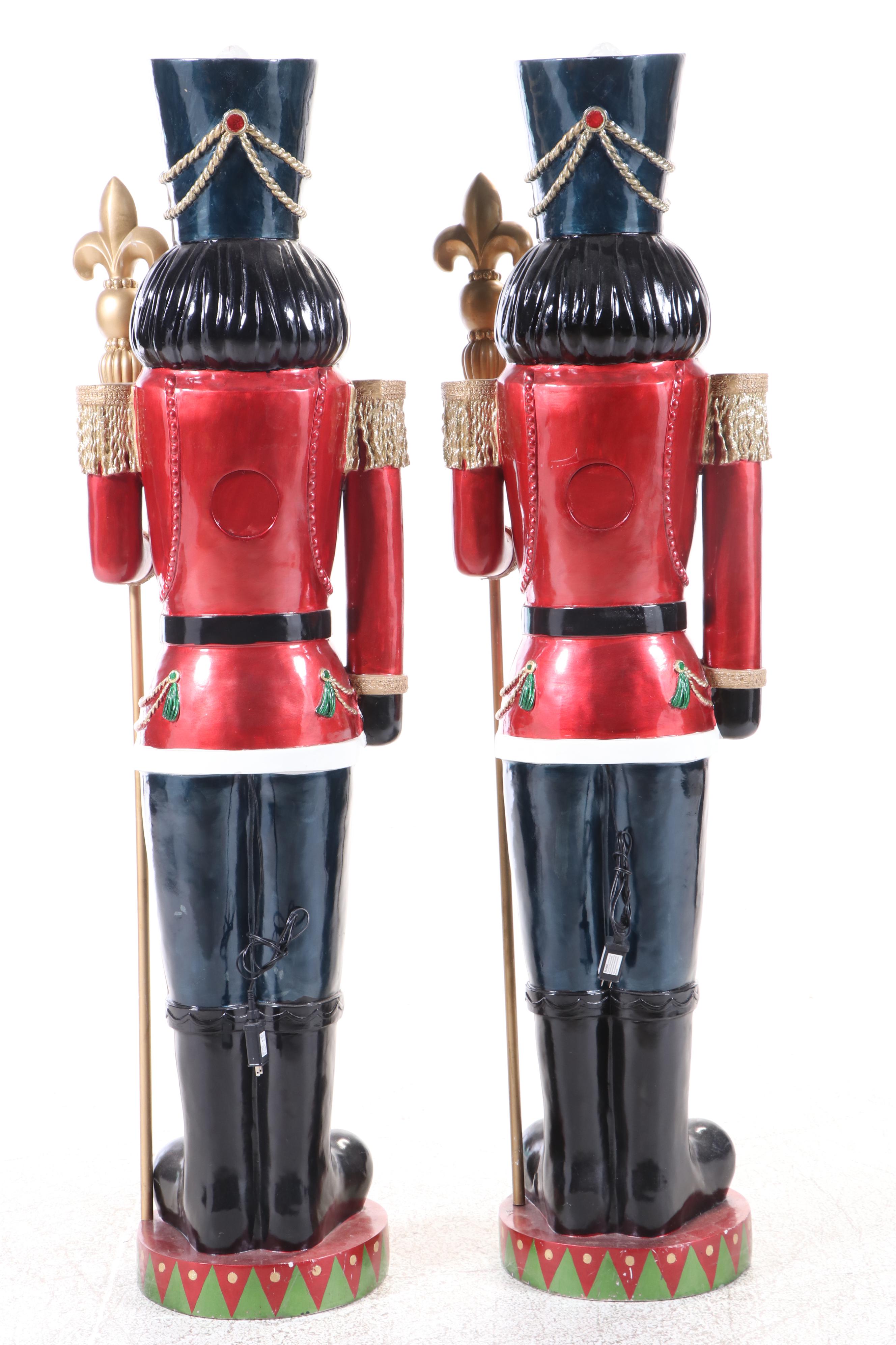 Pair of Molded and Painted Fiberglass Illuminated Life-Size Nutcracker Statues