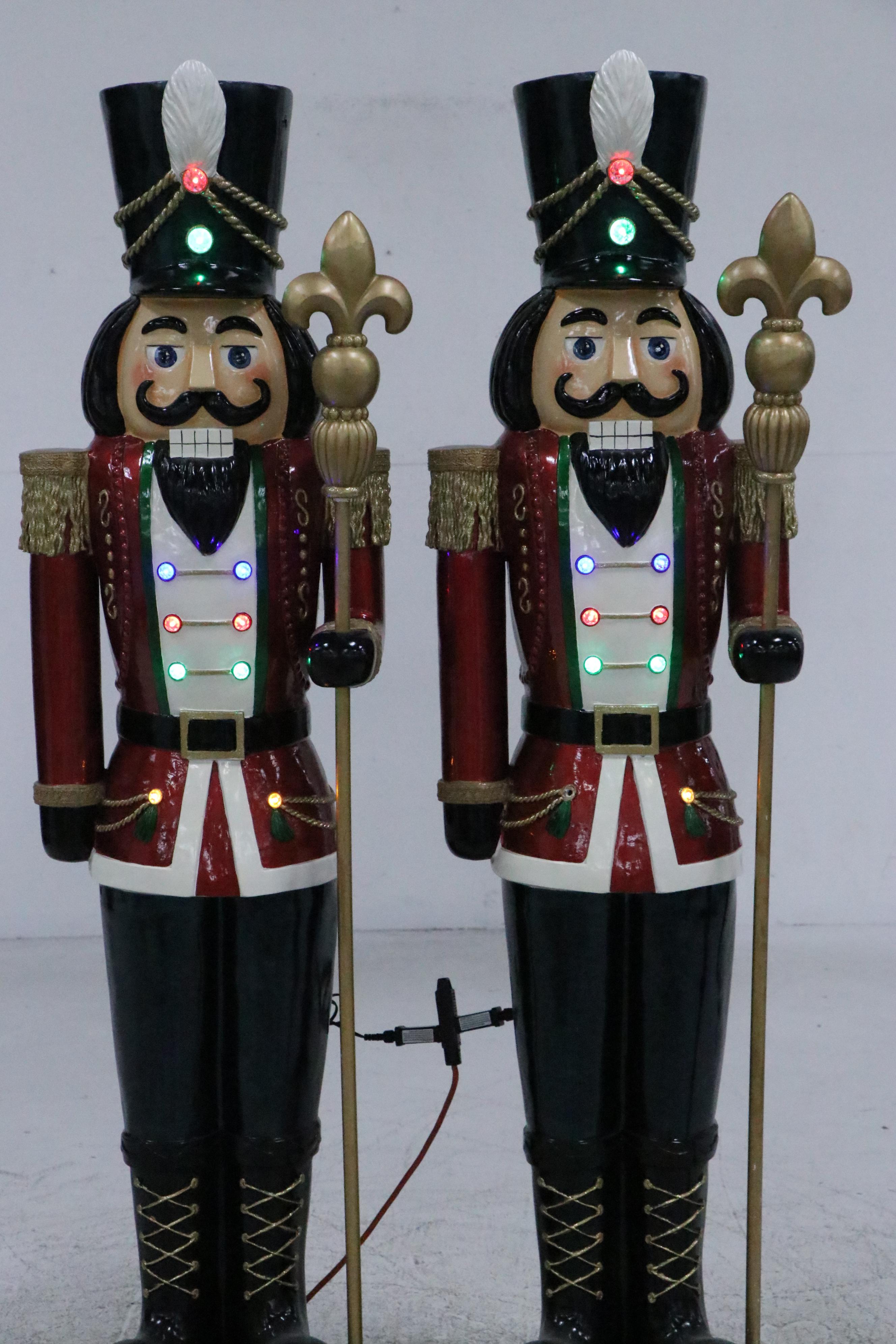 Pair of Molded and Painted Fiberglass Illuminated Life-Size Nutcracker Statues