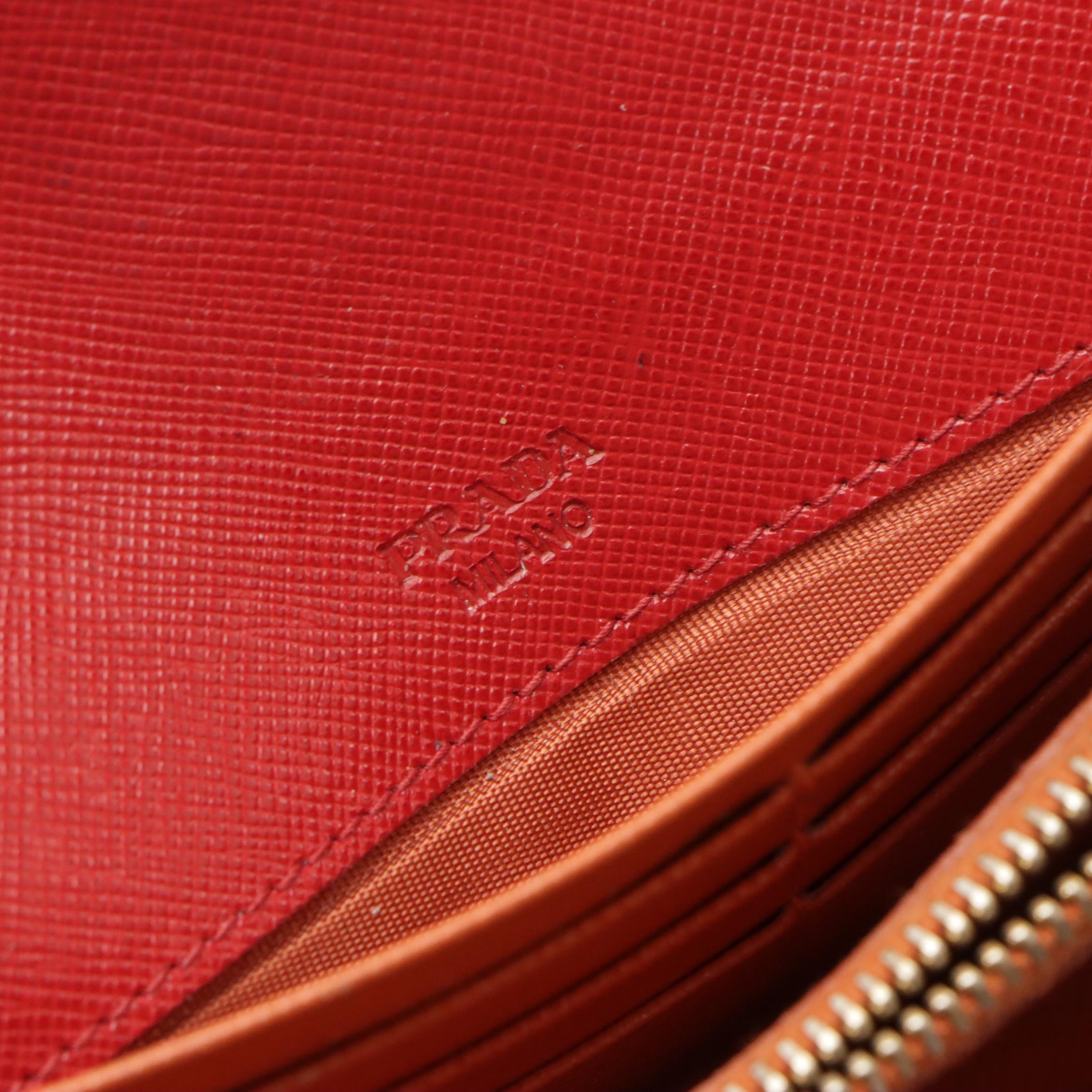 Prada Front Flap Long Wallet in Red and Orange Saffiano Wave Leather