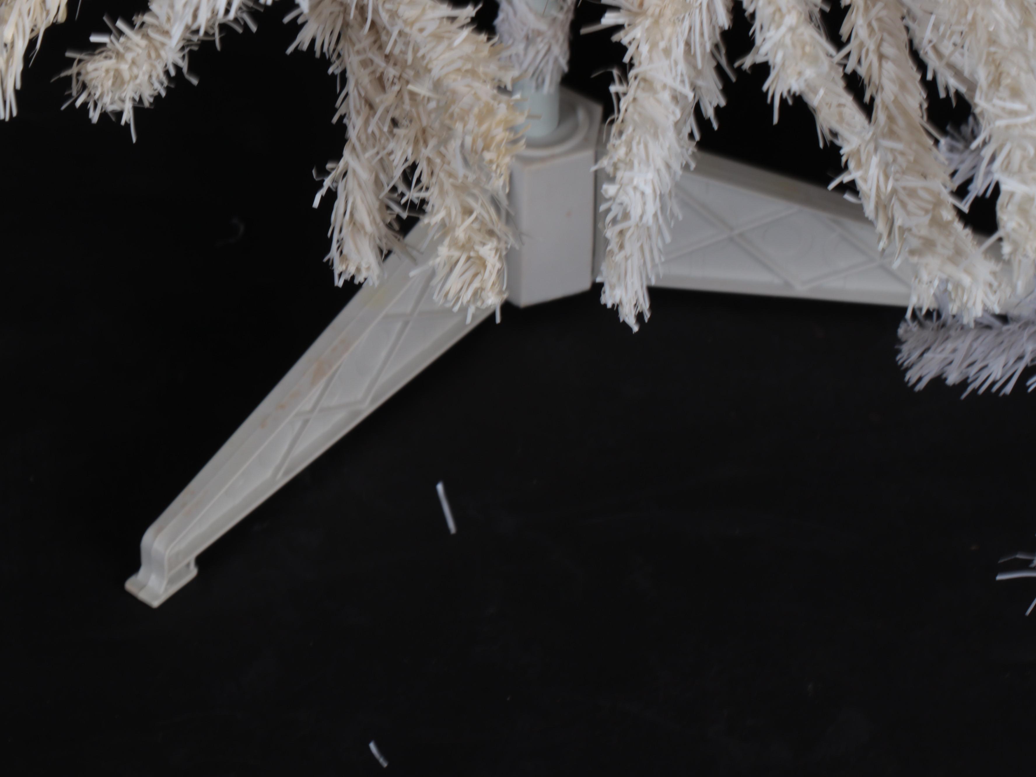 Large and Small Artificial Christmas Trees in White