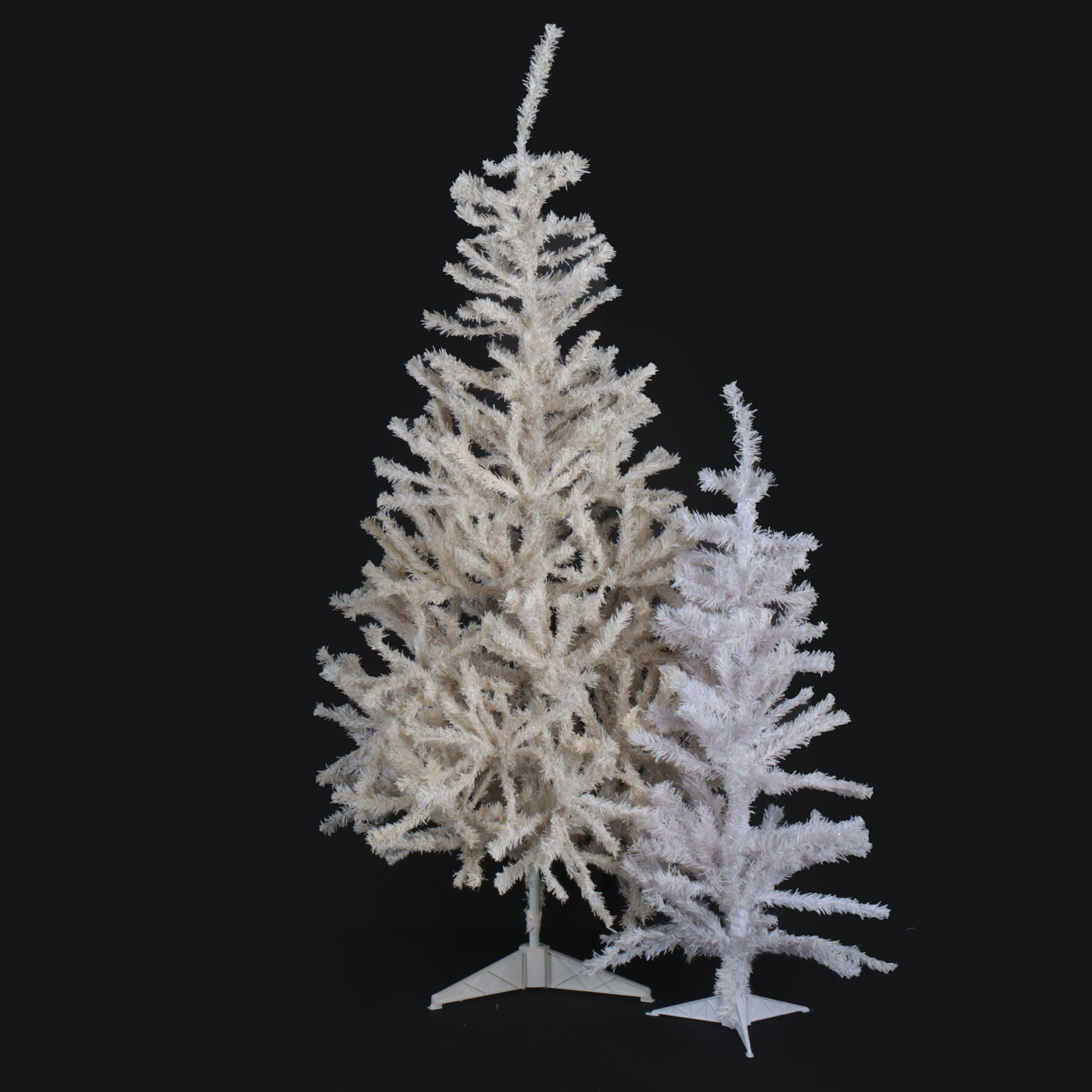 Large and Small Artificial Christmas Trees in White