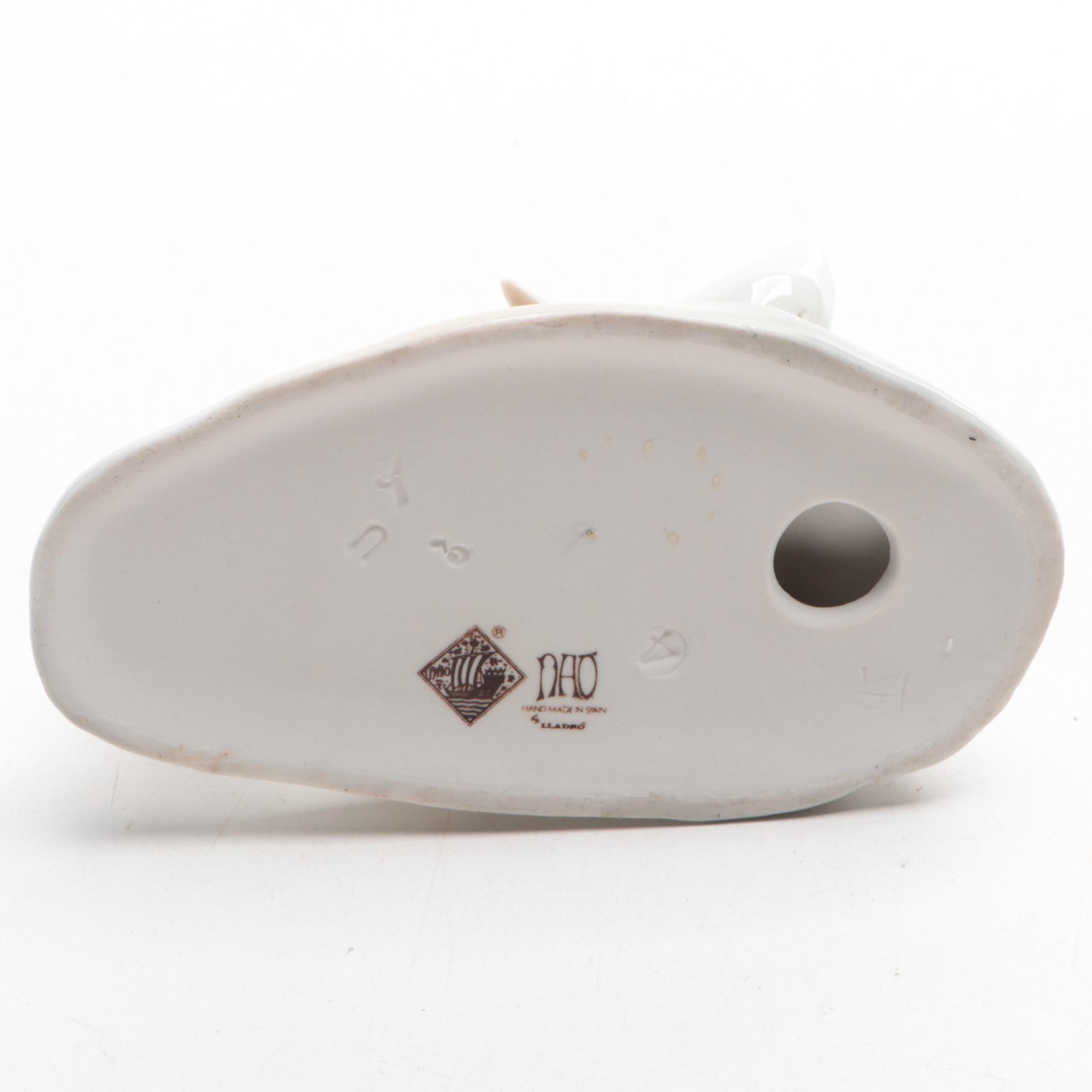 Lladró "Girl Holding Pig" with Nao by Lladró "April Showers" and Geese Figurines