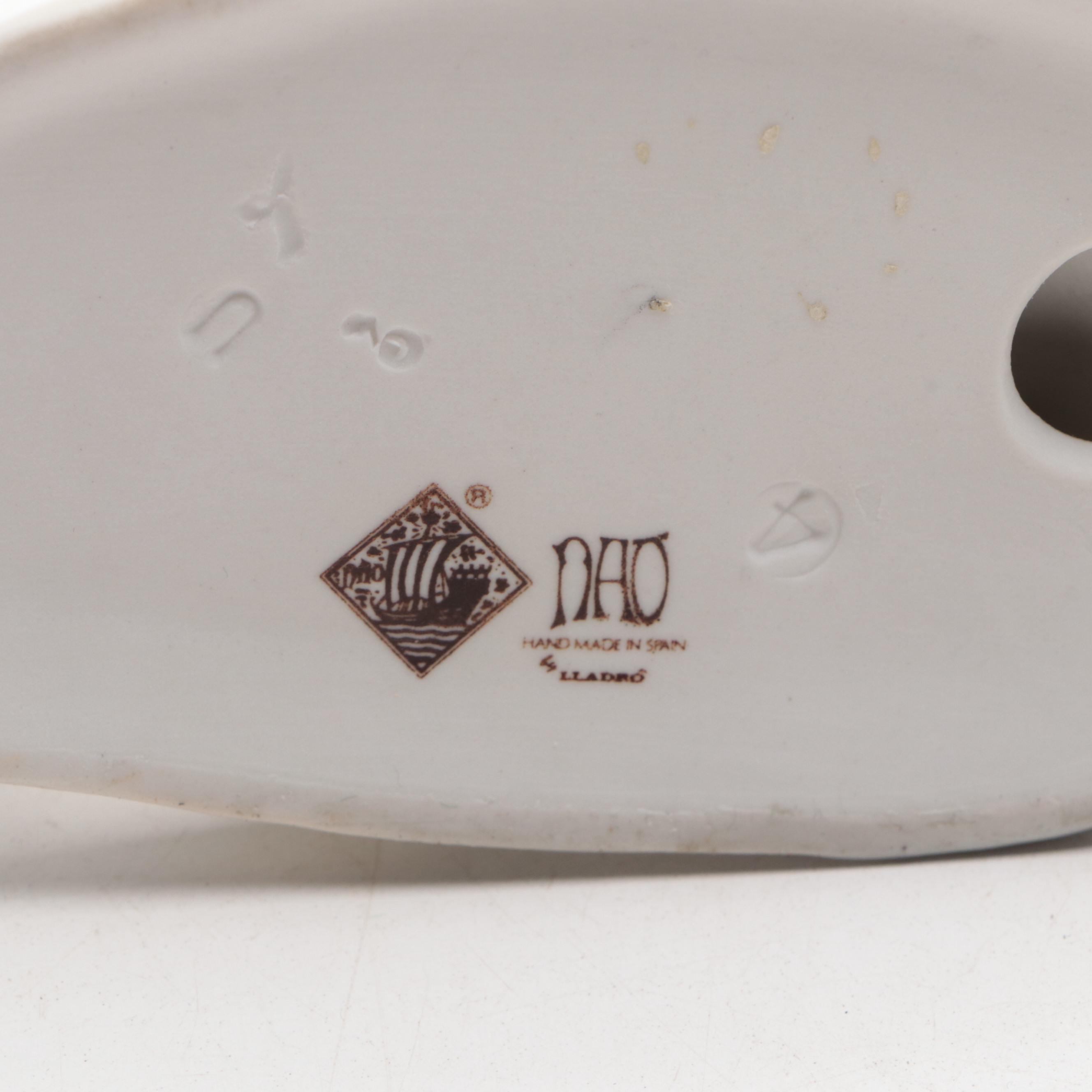 Lladró "Girl Holding Pig" with Nao by Lladró "April Showers" and Geese Figurines