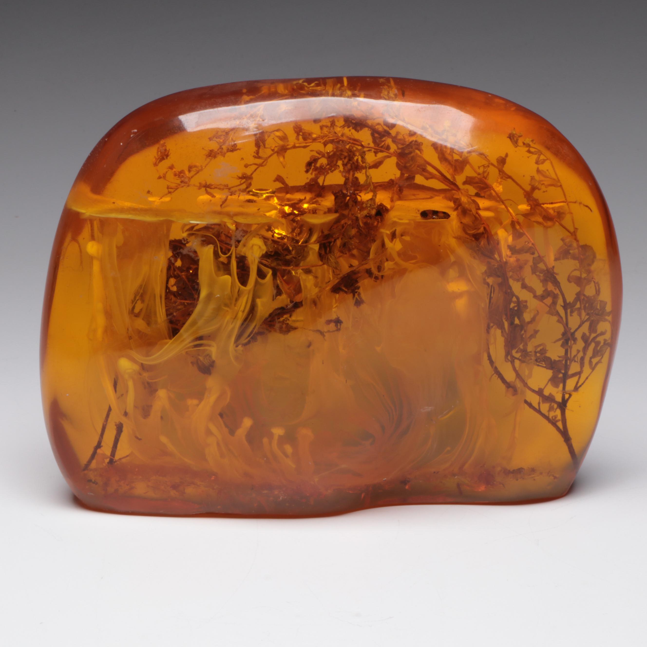 Amber Colored Resin Sculpture with Entrapped Plant Specimens