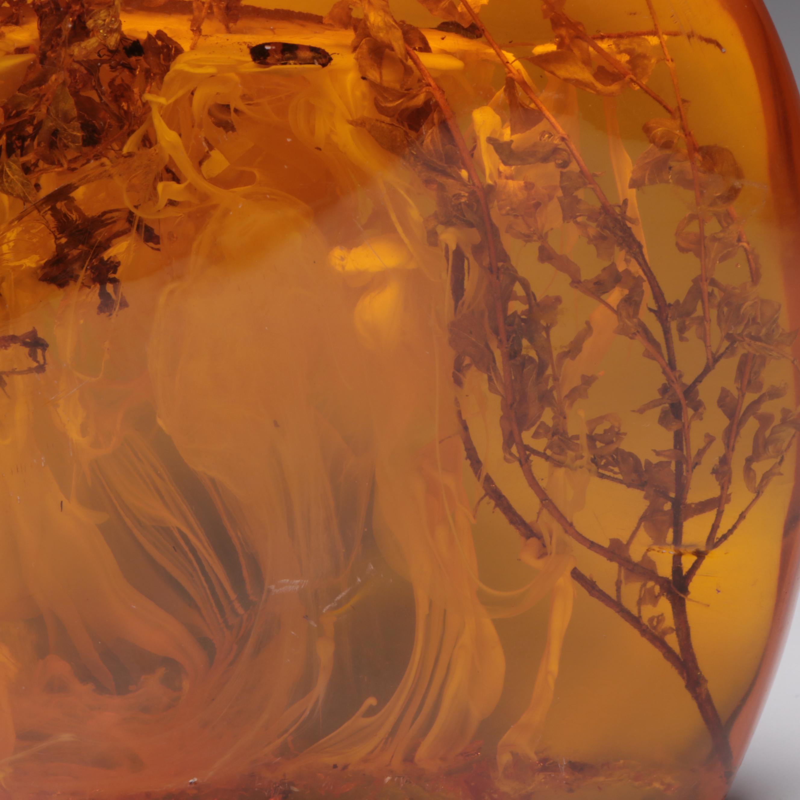 Amber Colored Resin Sculpture with Entrapped Plant Specimens