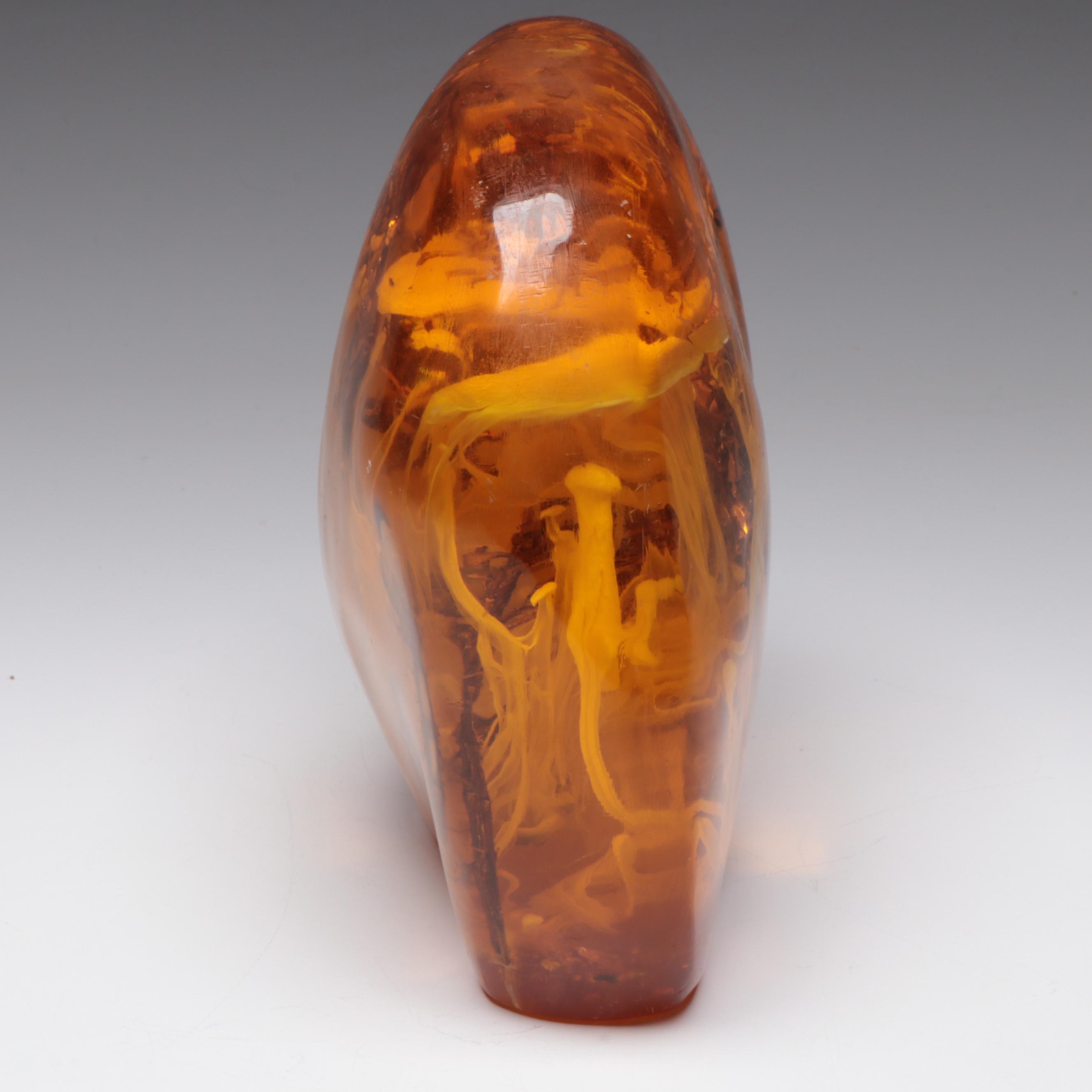 Amber Colored Resin Sculpture with Entrapped Plant Specimens