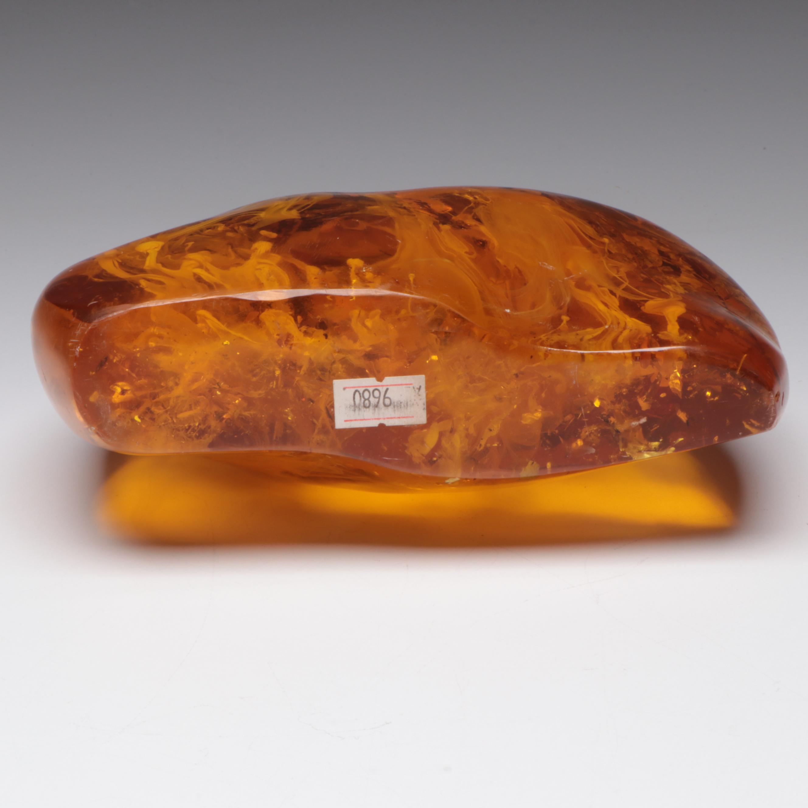 Amber Colored Resin Sculpture with Entrapped Plant Specimens
