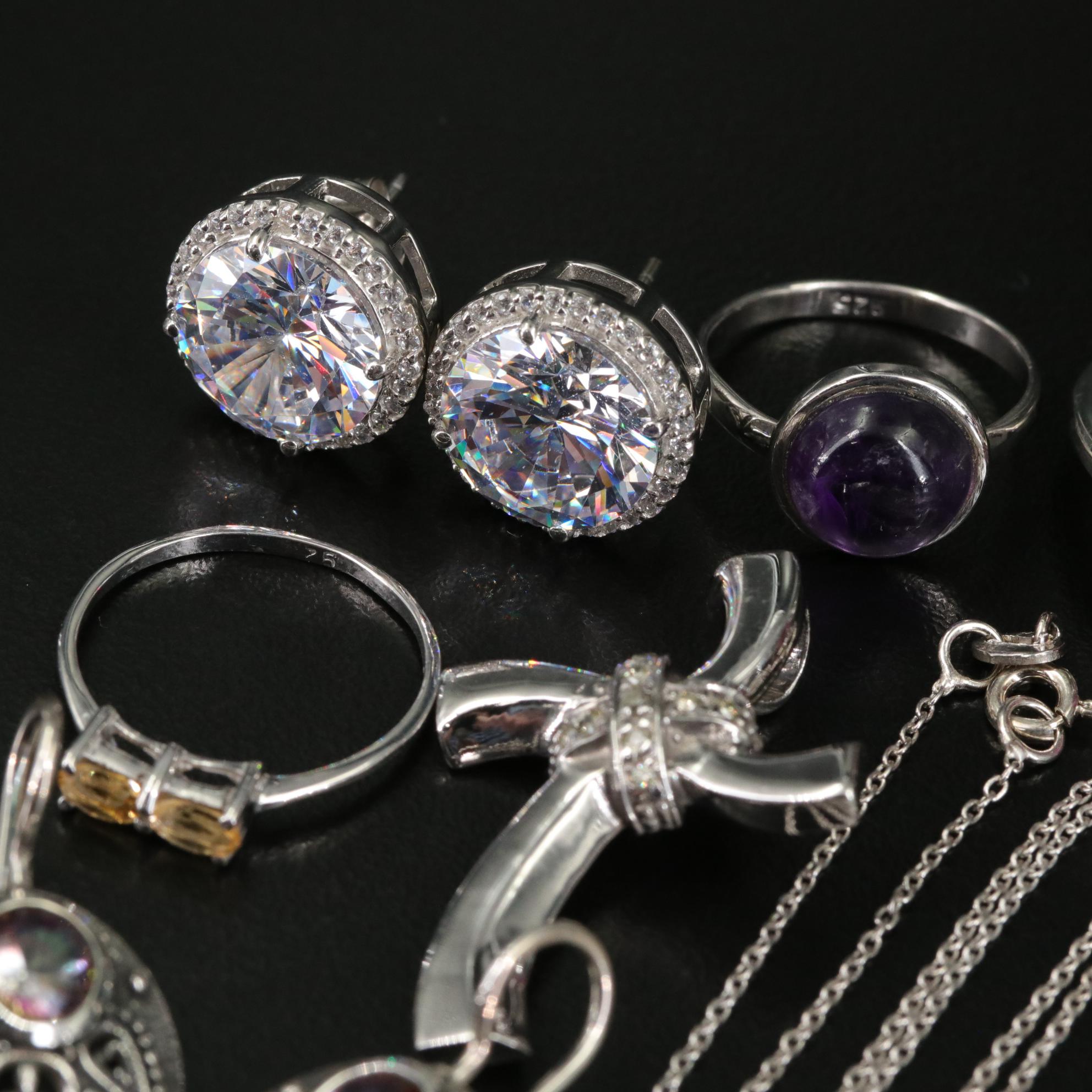 Group of 14 Assorted Sterling Silver Rings, Necklaces, Earrings, and Pendants