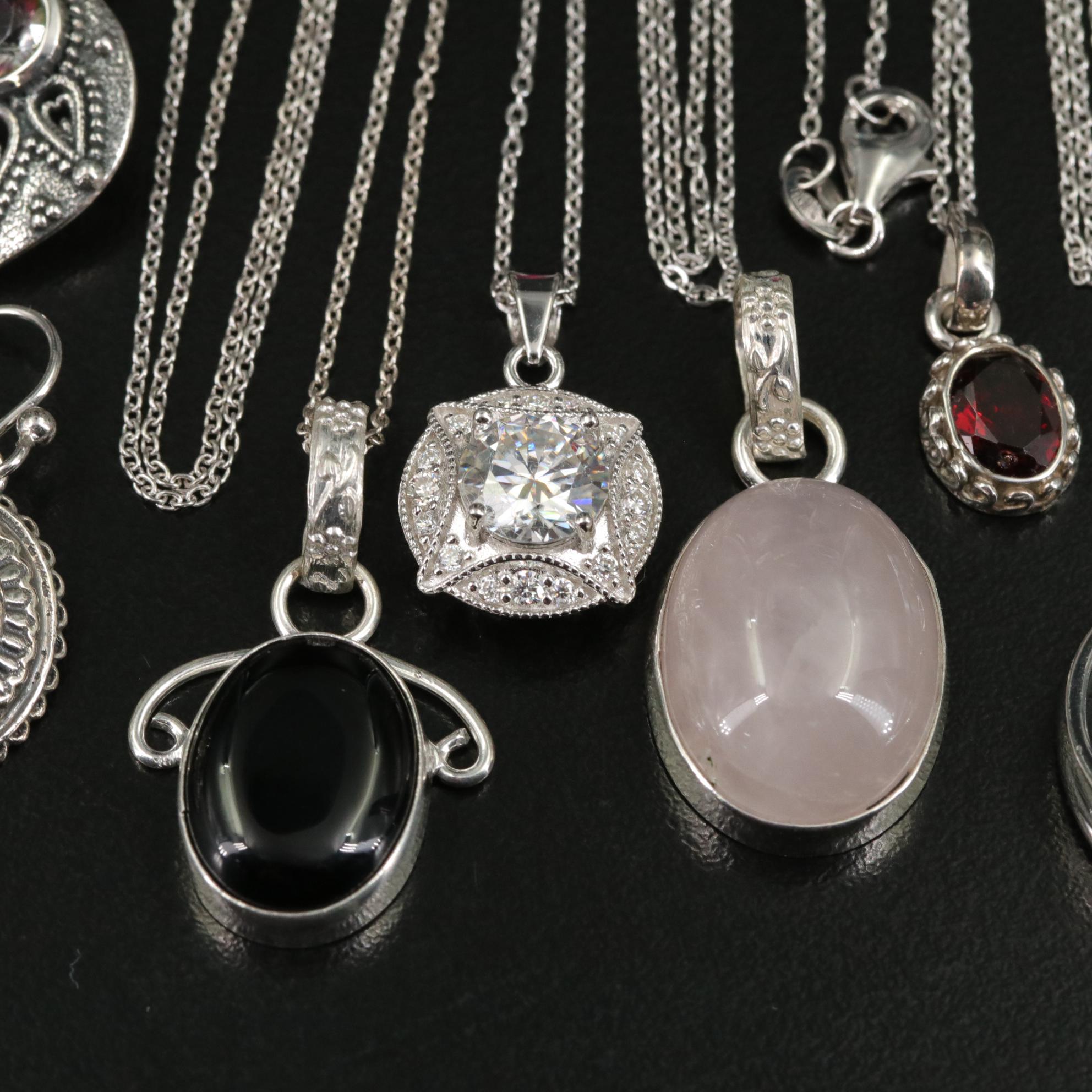 Group of 14 Assorted Sterling Silver Rings, Necklaces, Earrings, and Pendants