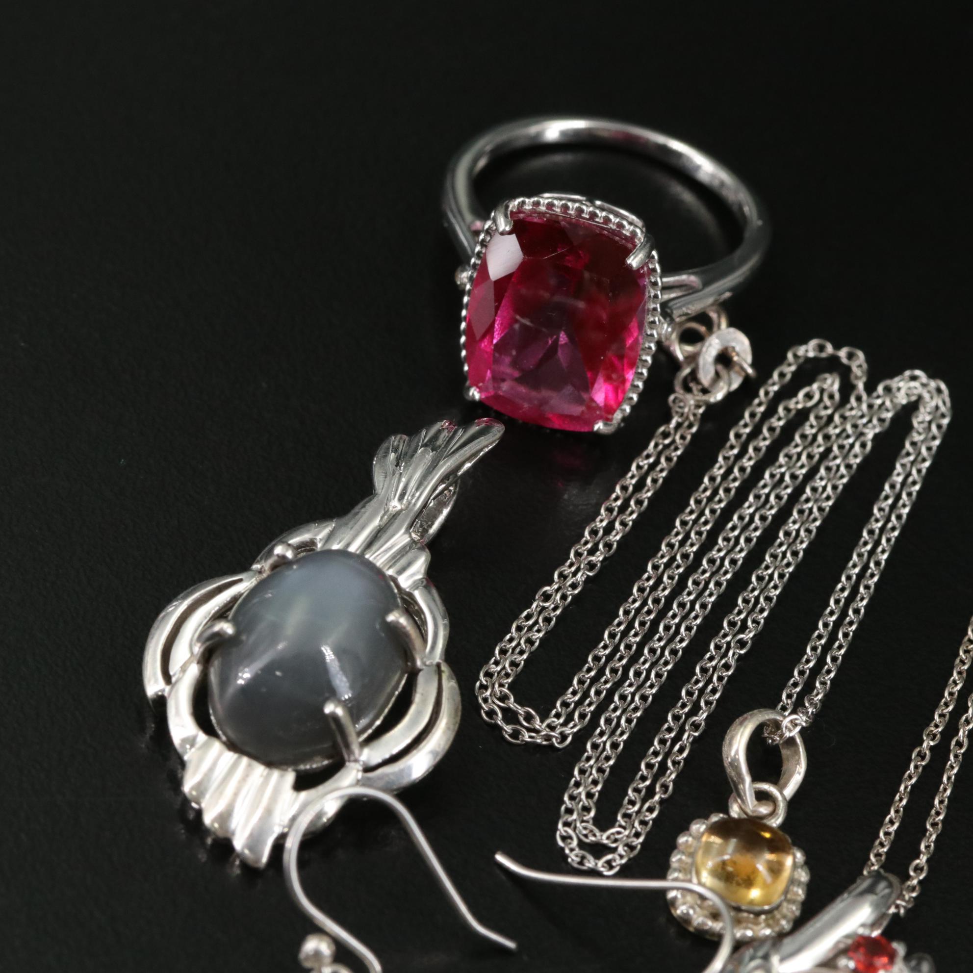 Group of 14 Assorted Sterling Silver Rings, Necklaces, Earrings, and Pendants