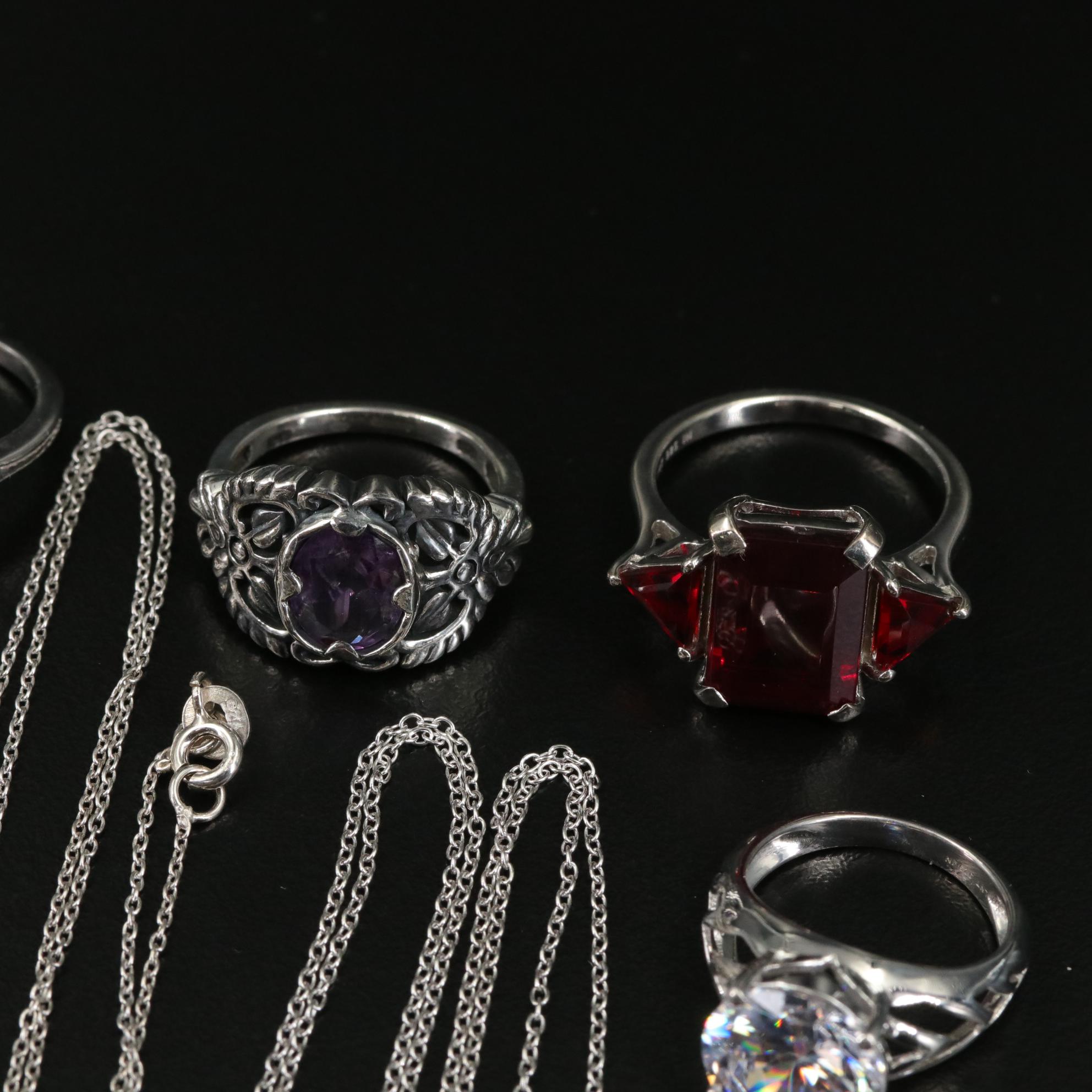 Group of 14 Assorted Sterling Silver Rings, Necklaces, Earrings, and Pendants