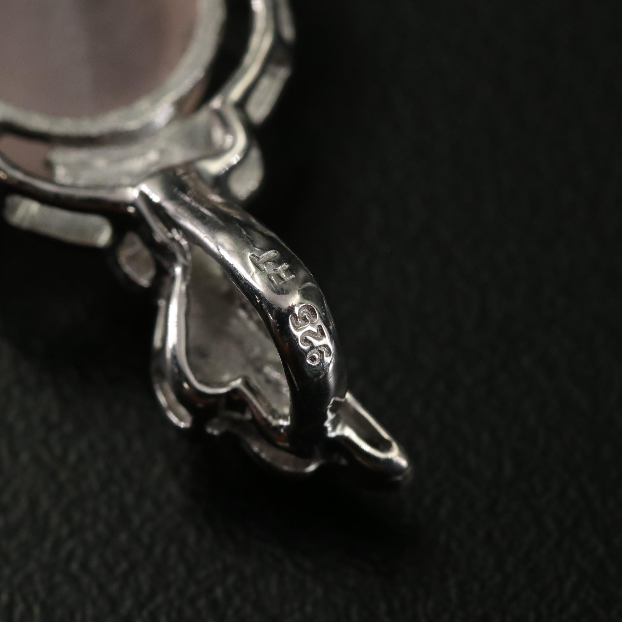 Group of 14 Assorted Sterling Silver Rings, Necklaces, Earrings, and Pendants