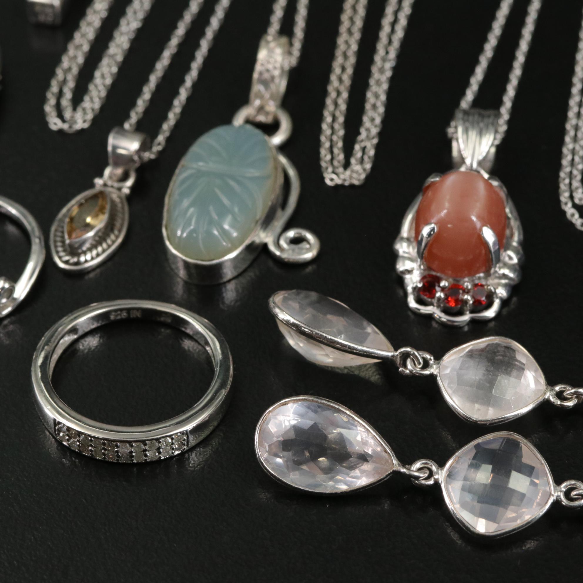 Group of 14 Assorted Sterling Silver Rings, Necklaces, Earrings, and Pendants