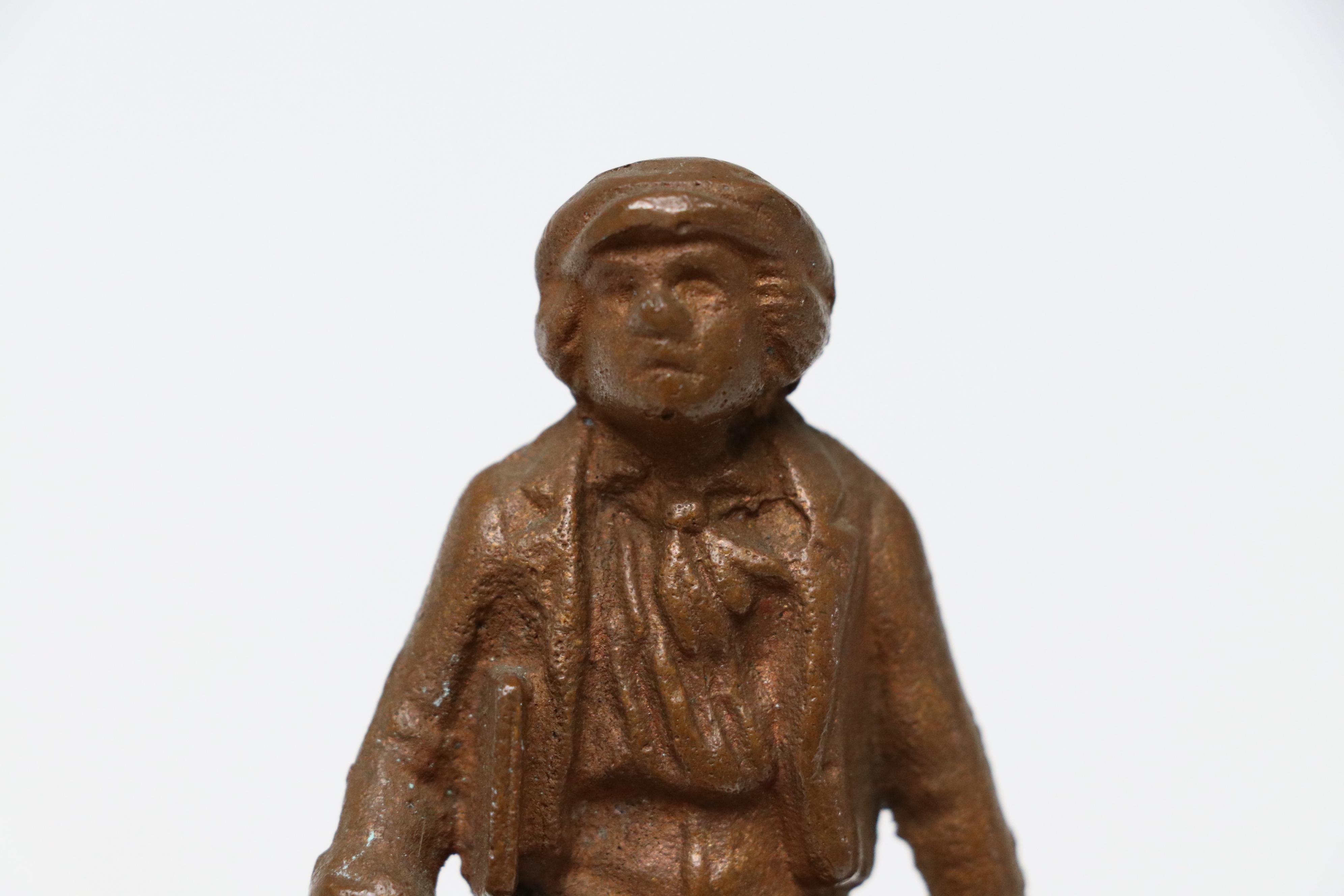 Victorian Shoe Shine Boy with Other Cast Metal Figurines