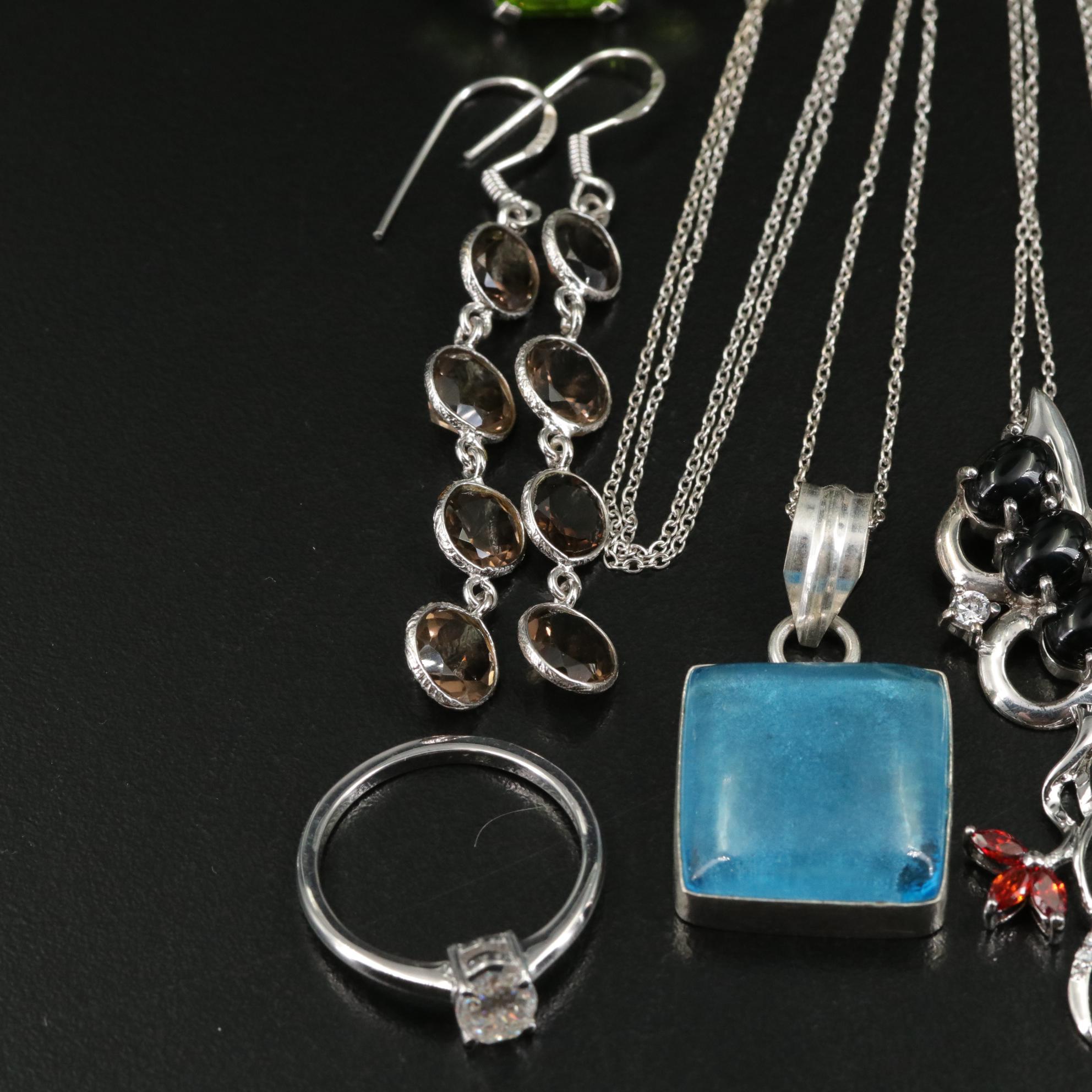 Group of 14 Assorted Sterling Silver Rings, Necklaces, Earrings, and Pendants