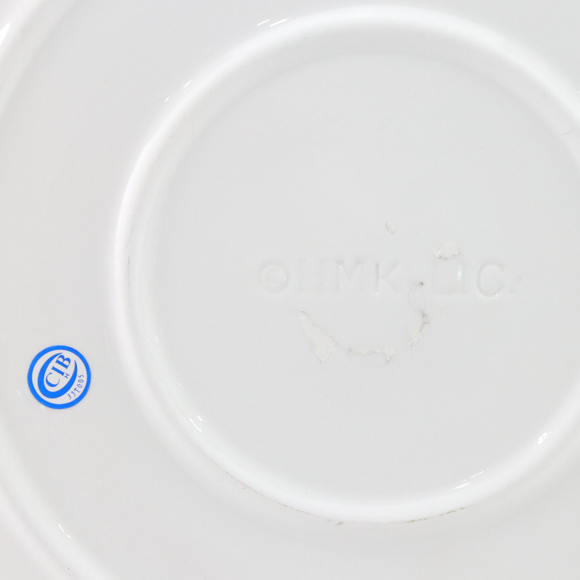 Metal Snowman Wine Bottle Holder, Reindeer Wall Hanging, & Ceramic Santa Plates