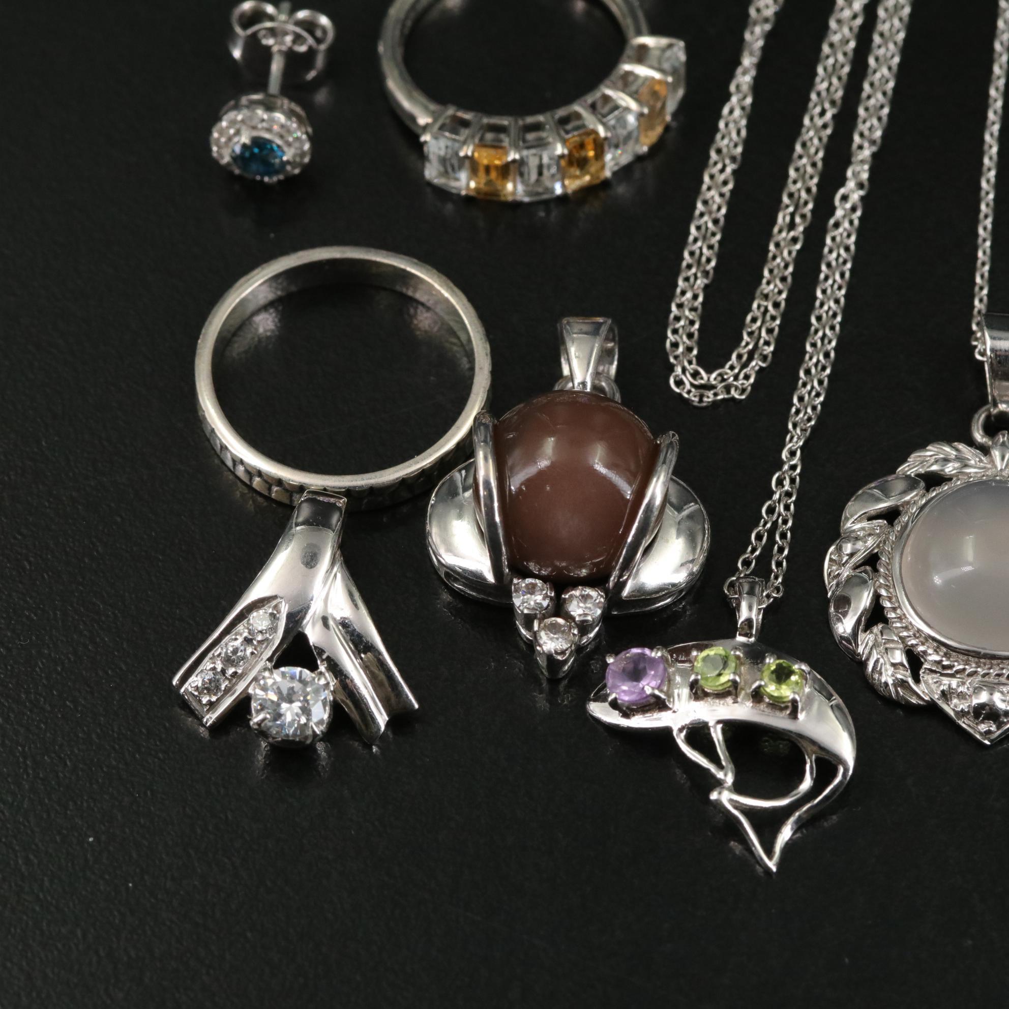 Group of 14 Assorted Sterling Silver Rings, Necklaces, Earrings, and Pendants