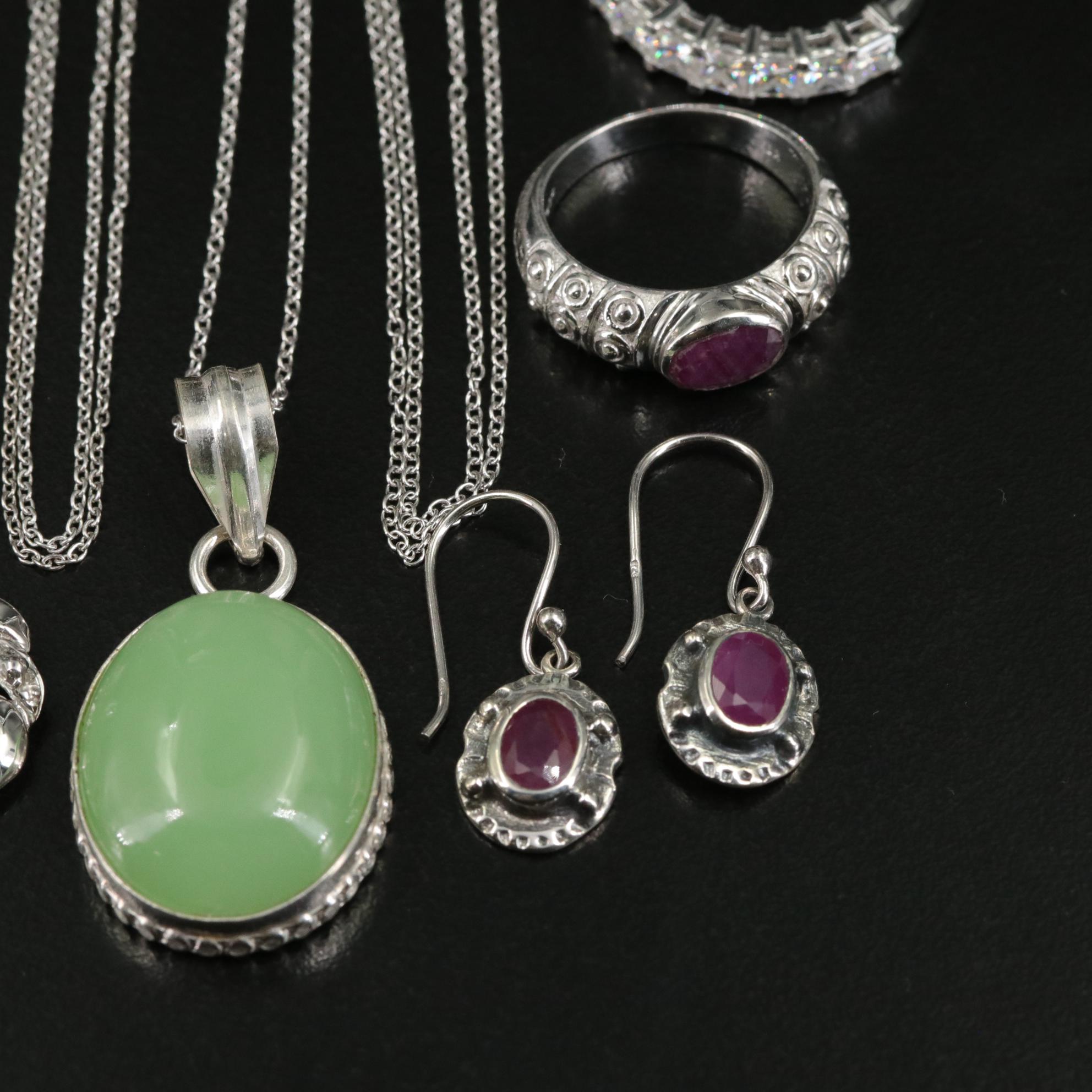 Group of 14 Assorted Sterling Silver Rings, Necklaces, Earrings, and Pendants