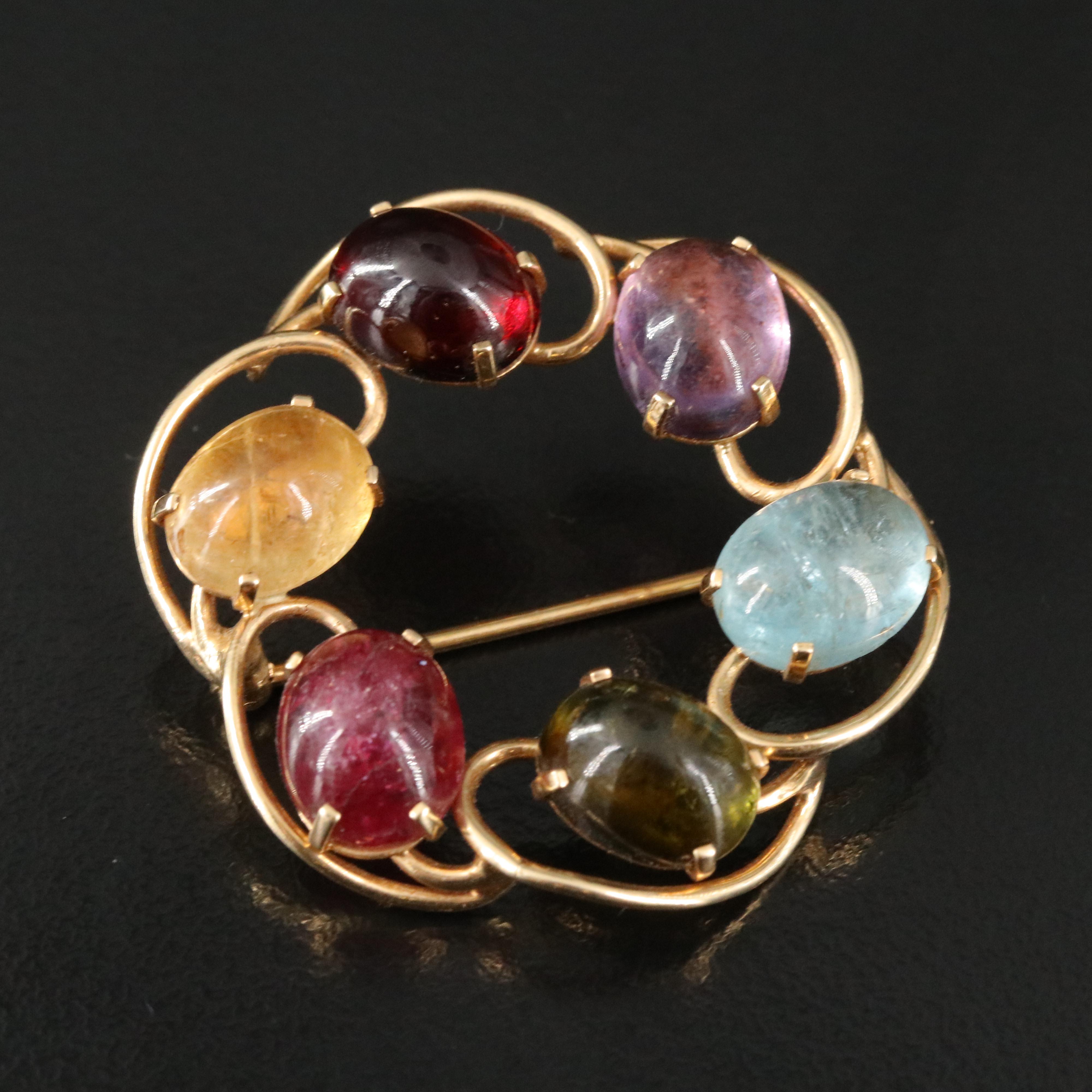 14K Circle Brooch Featuring Tourmaline, Topaz, and Garnet