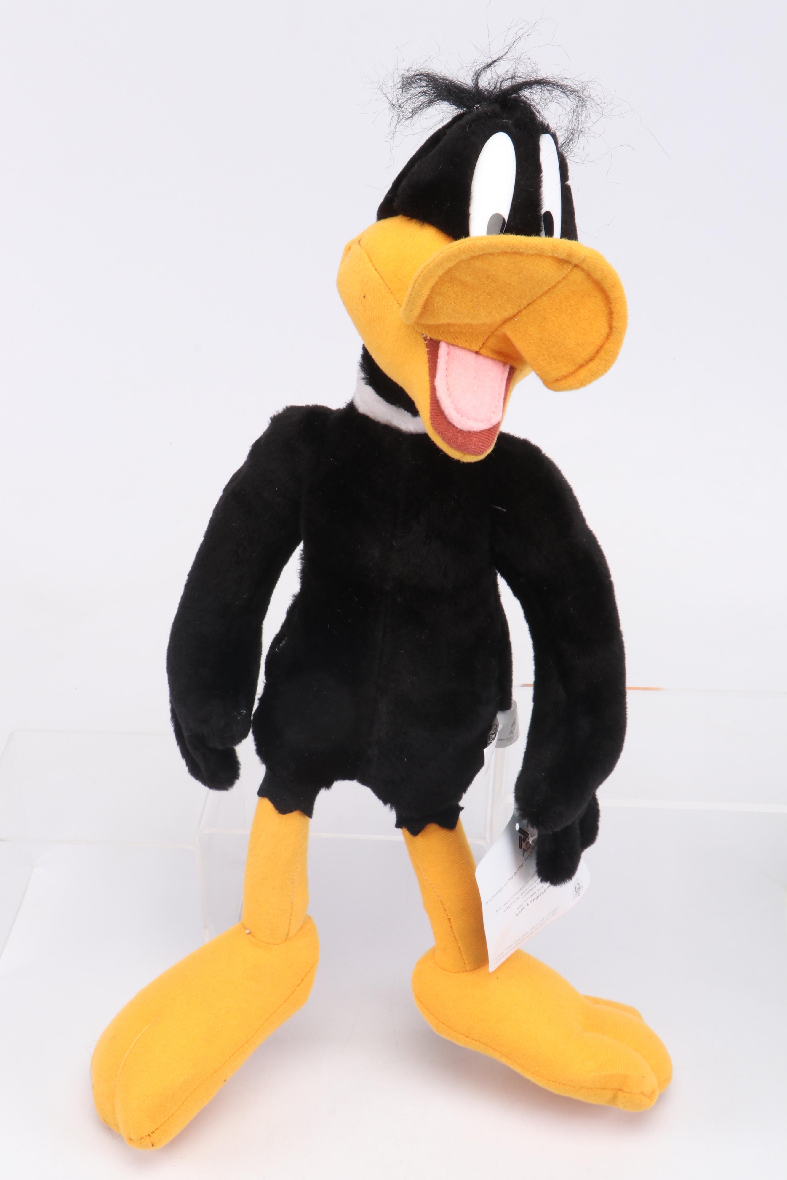 Daffy Duck and Pepé Le Pew Stuffed Toys with Yo-Yos, VHS Tapes, and Frisbees