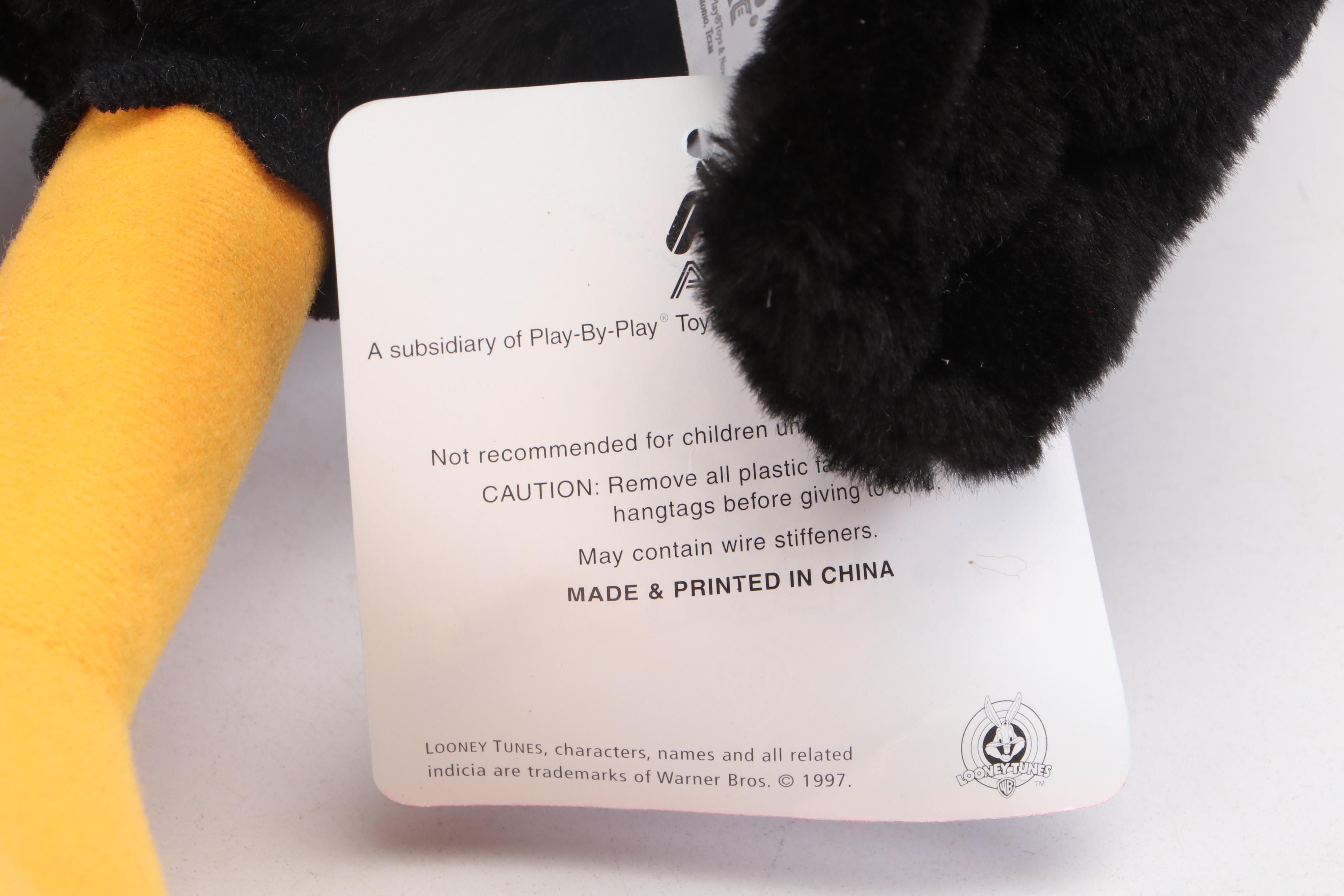 Daffy Duck and Pepé Le Pew Stuffed Toys with Yo-Yos, VHS Tapes, and Frisbees