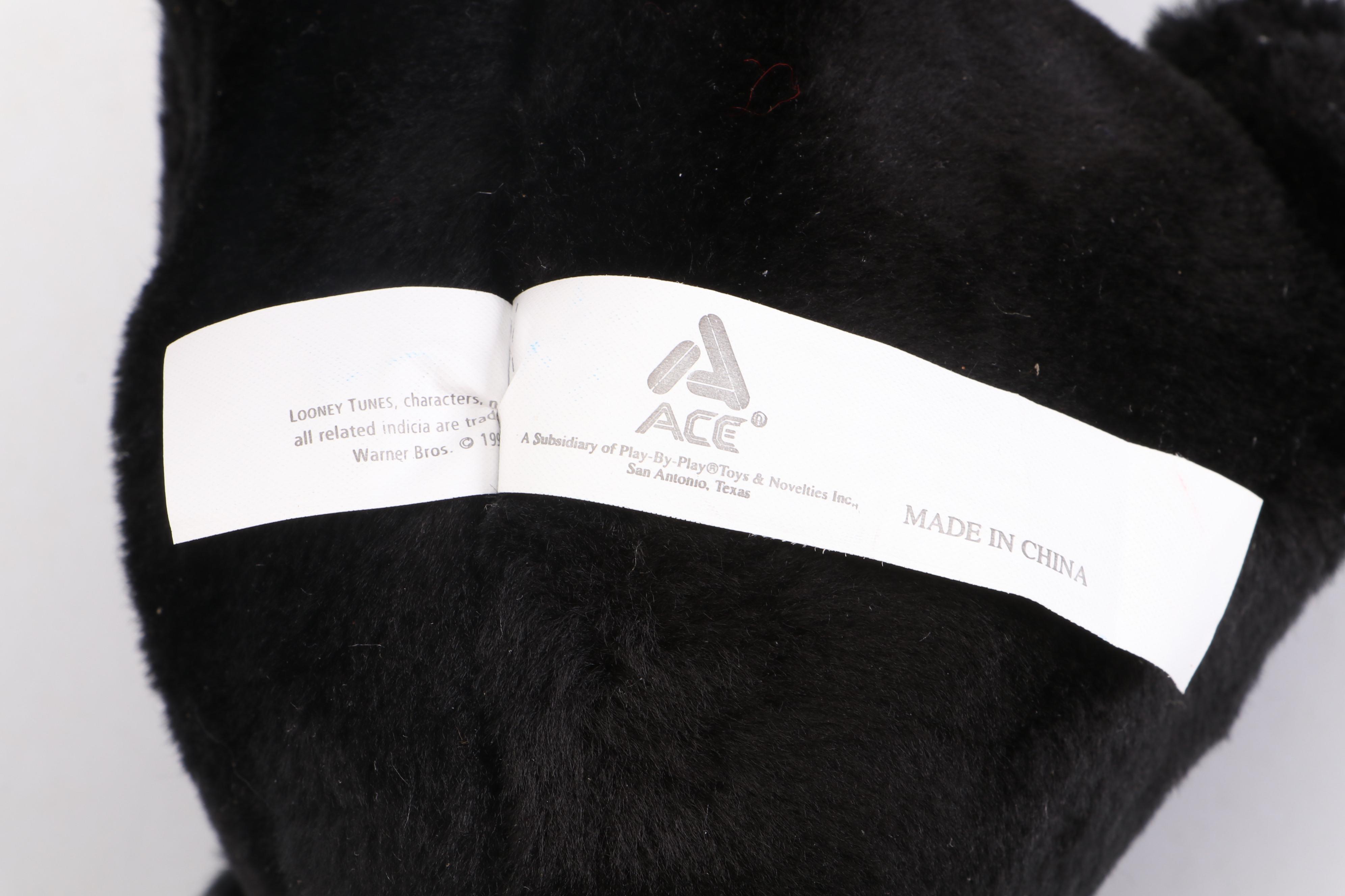 Daffy Duck and Pepé Le Pew Stuffed Toys with Yo-Yos, VHS Tapes, and Frisbees