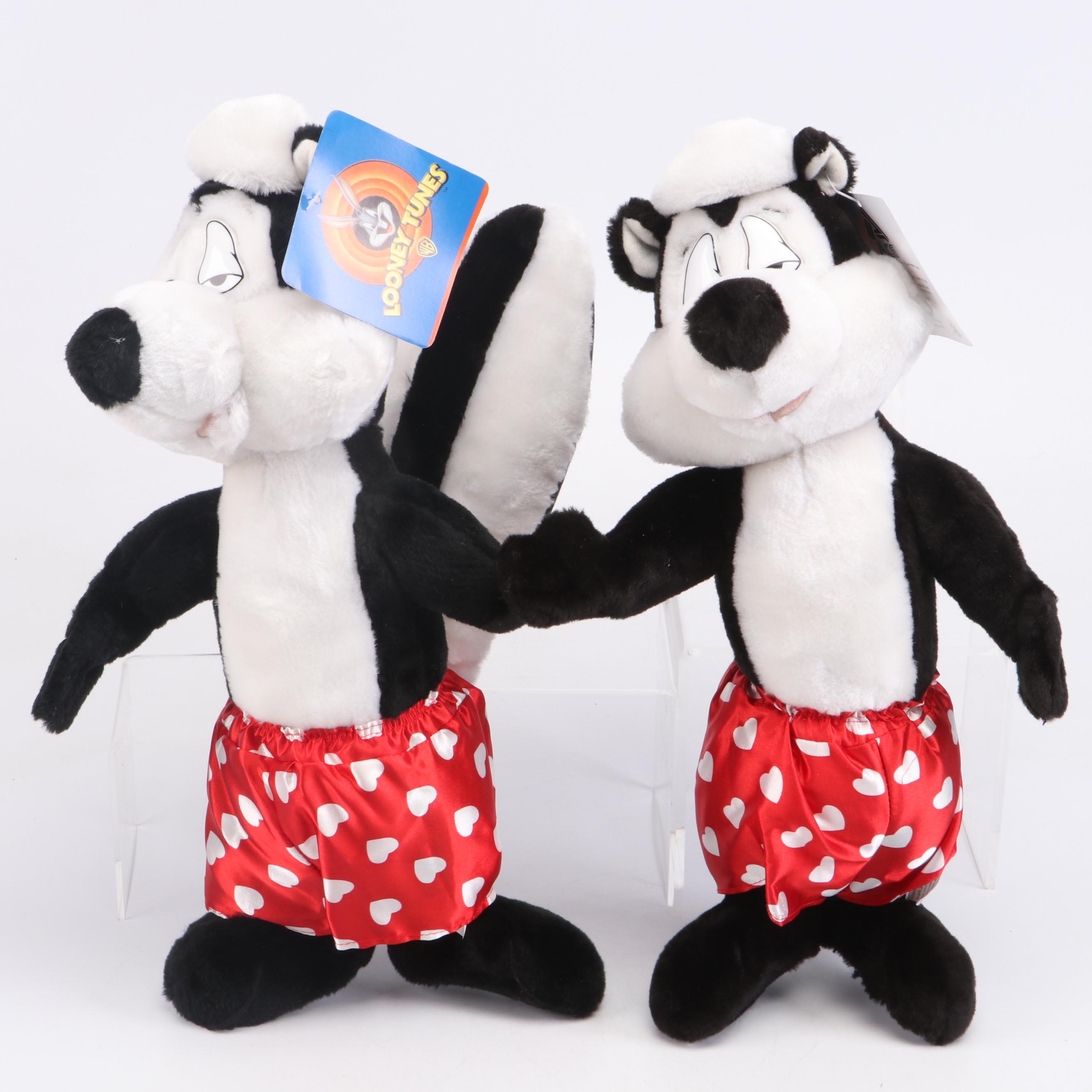 Daffy Duck and Pepé Le Pew Stuffed Toys with Yo-Yos, VHS Tapes, and Frisbees