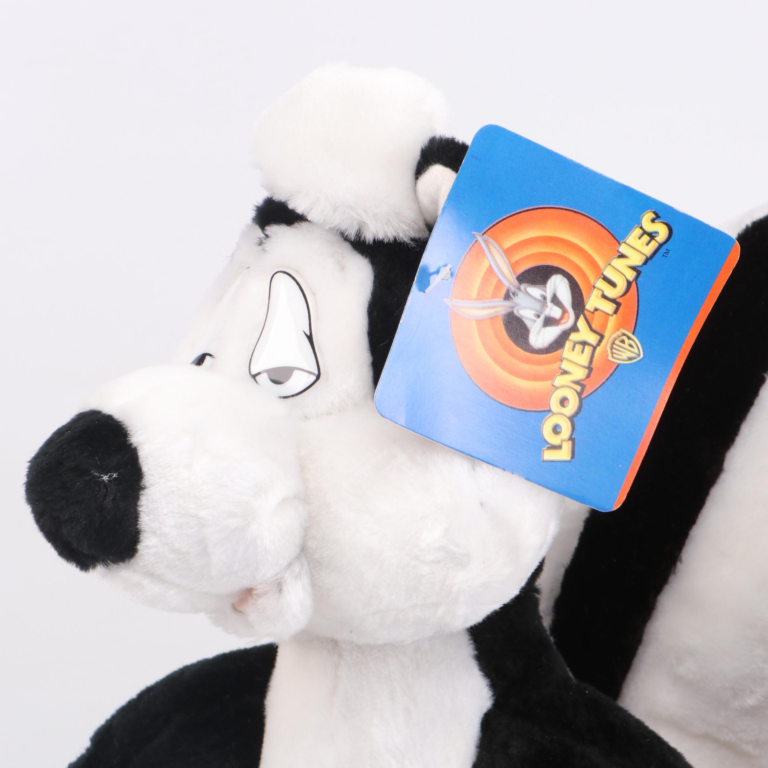 Daffy Duck and Pepé Le Pew Stuffed Toys with Yo-Yos, VHS Tapes, and Frisbees