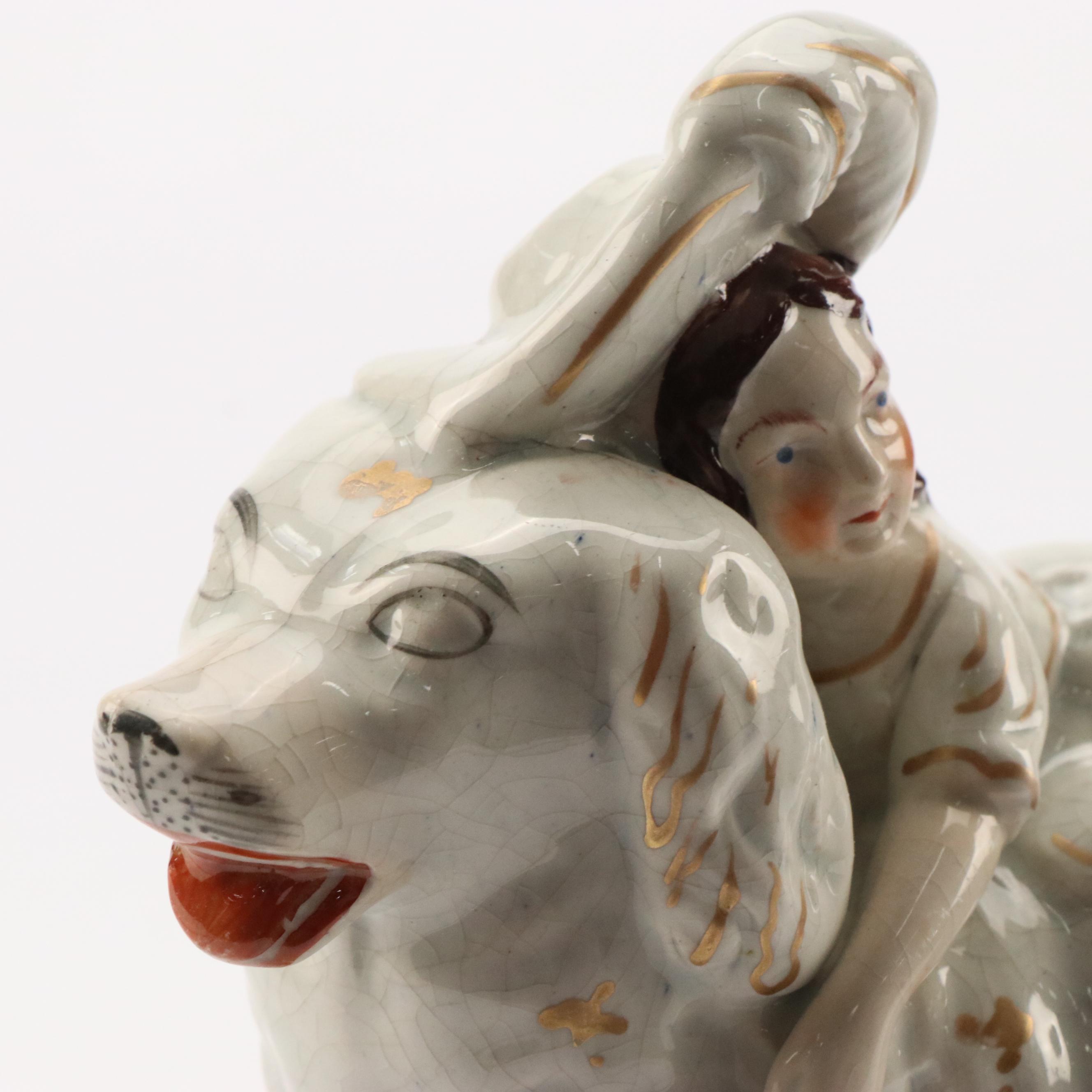 Staffordshire Earthenware Gilt Accented Girl with Dog  Figurine, 19th Century