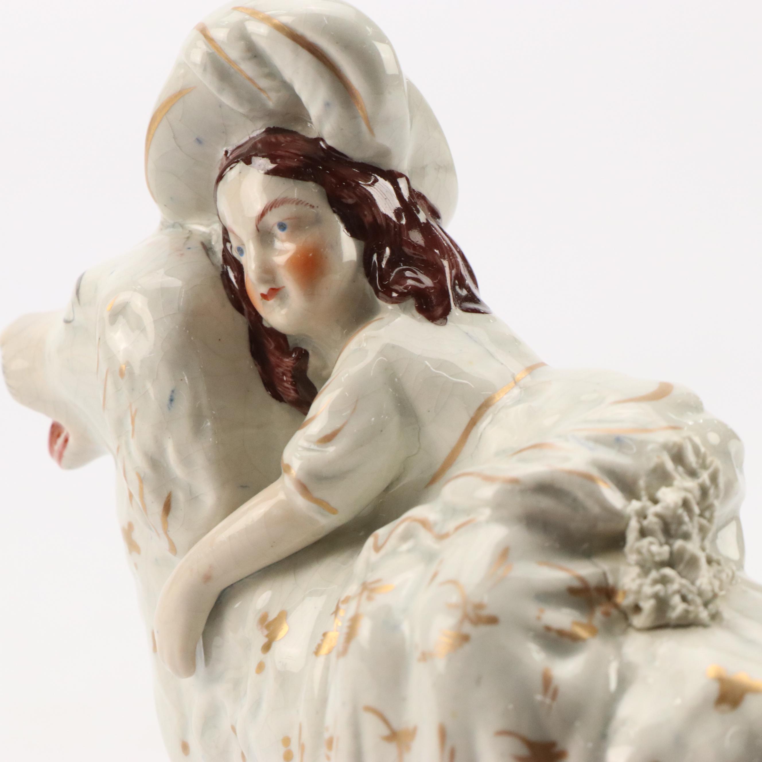 Staffordshire Earthenware Gilt Accented Girl with Dog  Figurine, 19th Century