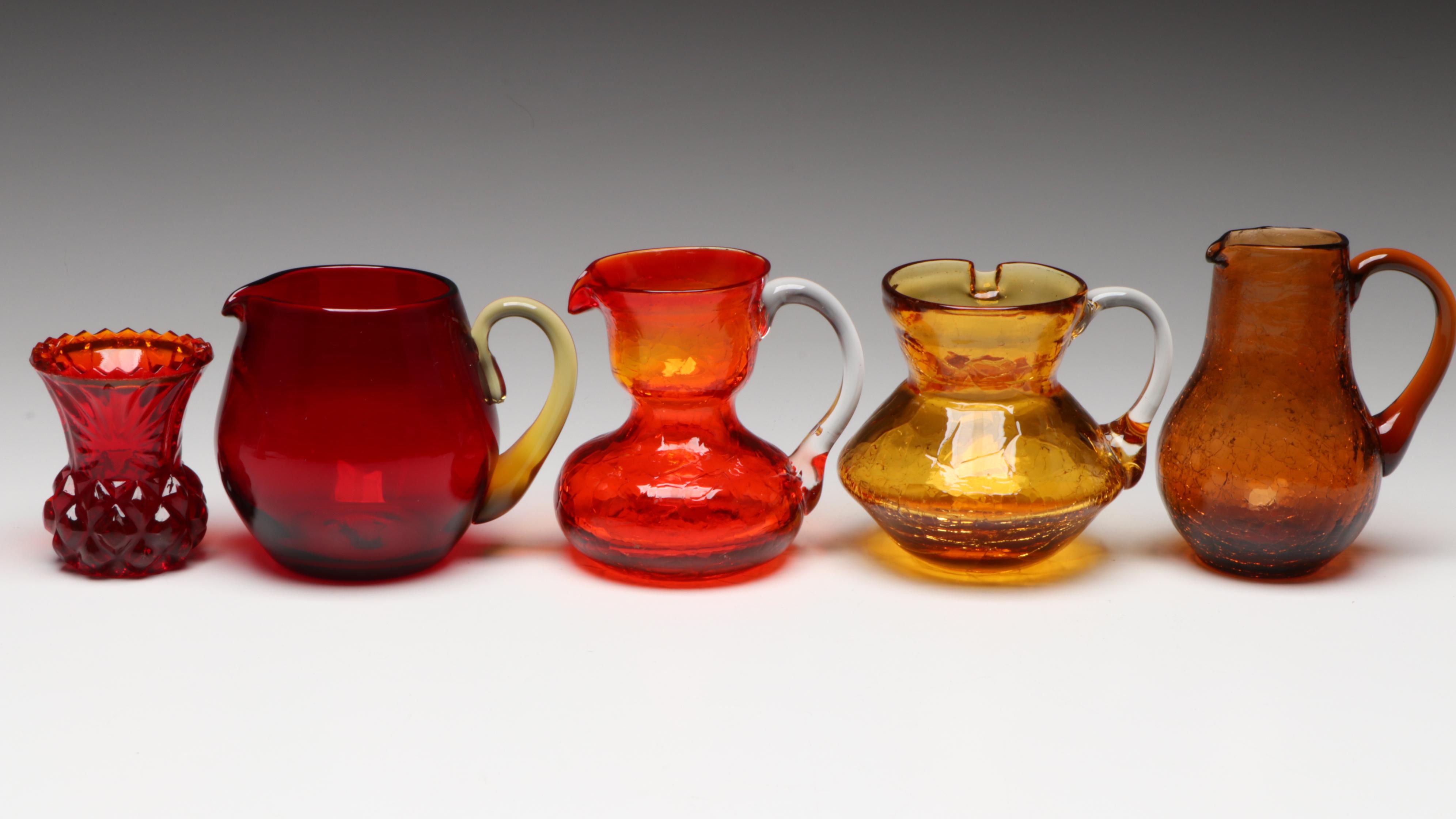 Pilgrim Crackle Glass Pitcher with Other Red and Amber Glass Decor