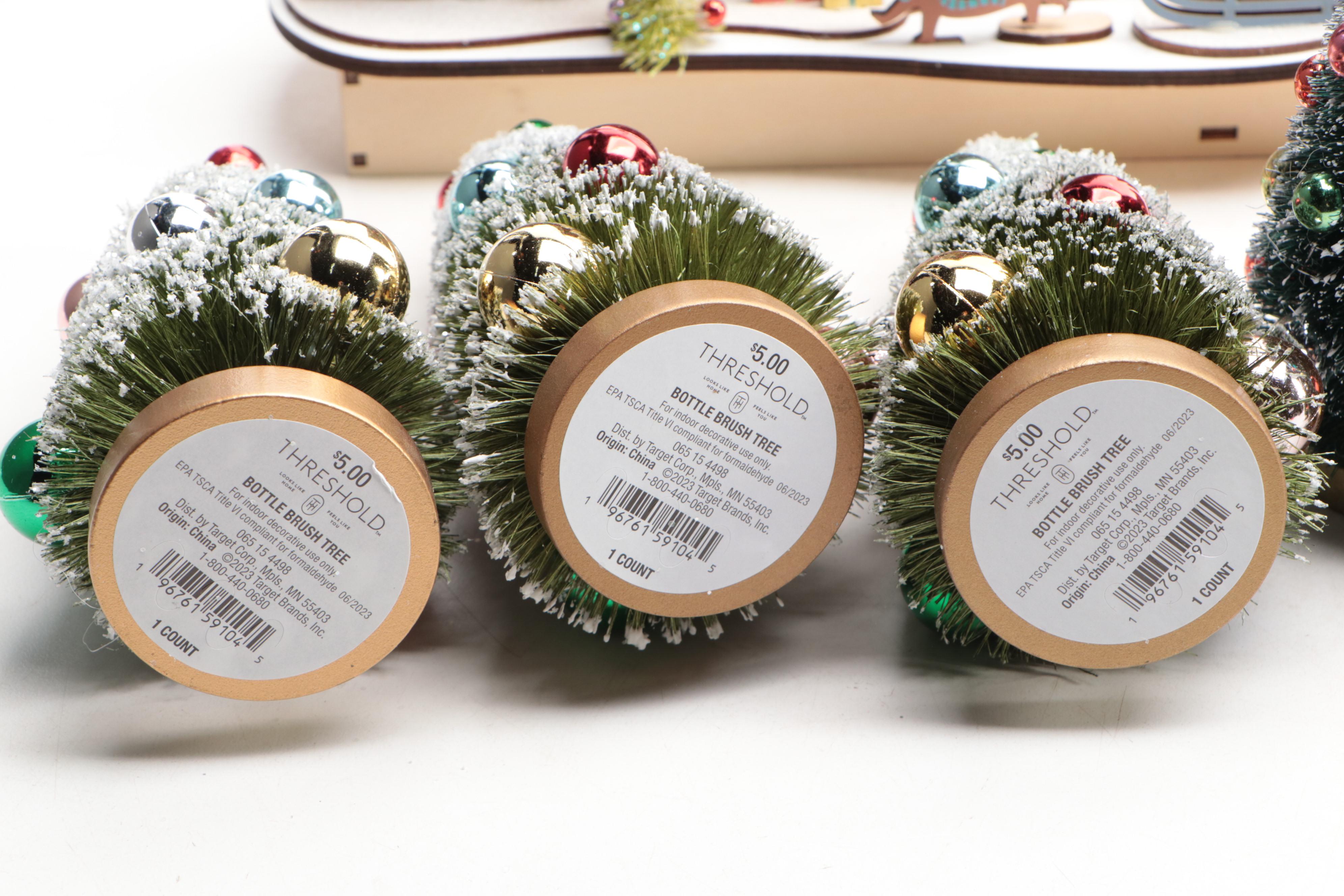 World Market Laser-Cut Wood Christmas Village Décor with Bottlebrush Trees, More